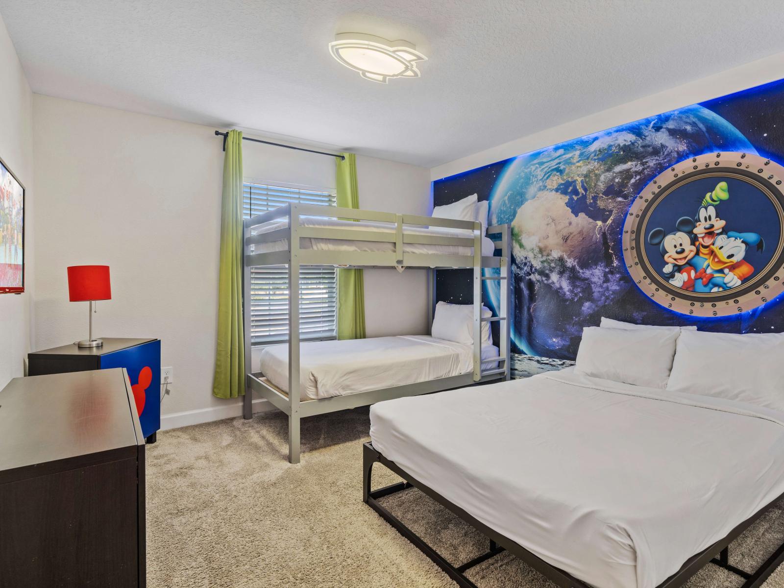 Mickey Mouse themed bedroom of the townhouse in Kissimmee Florida - Features a double bed and bunker bed - Cozy retreat, perfect for relaxation - Smart TV for entertainment