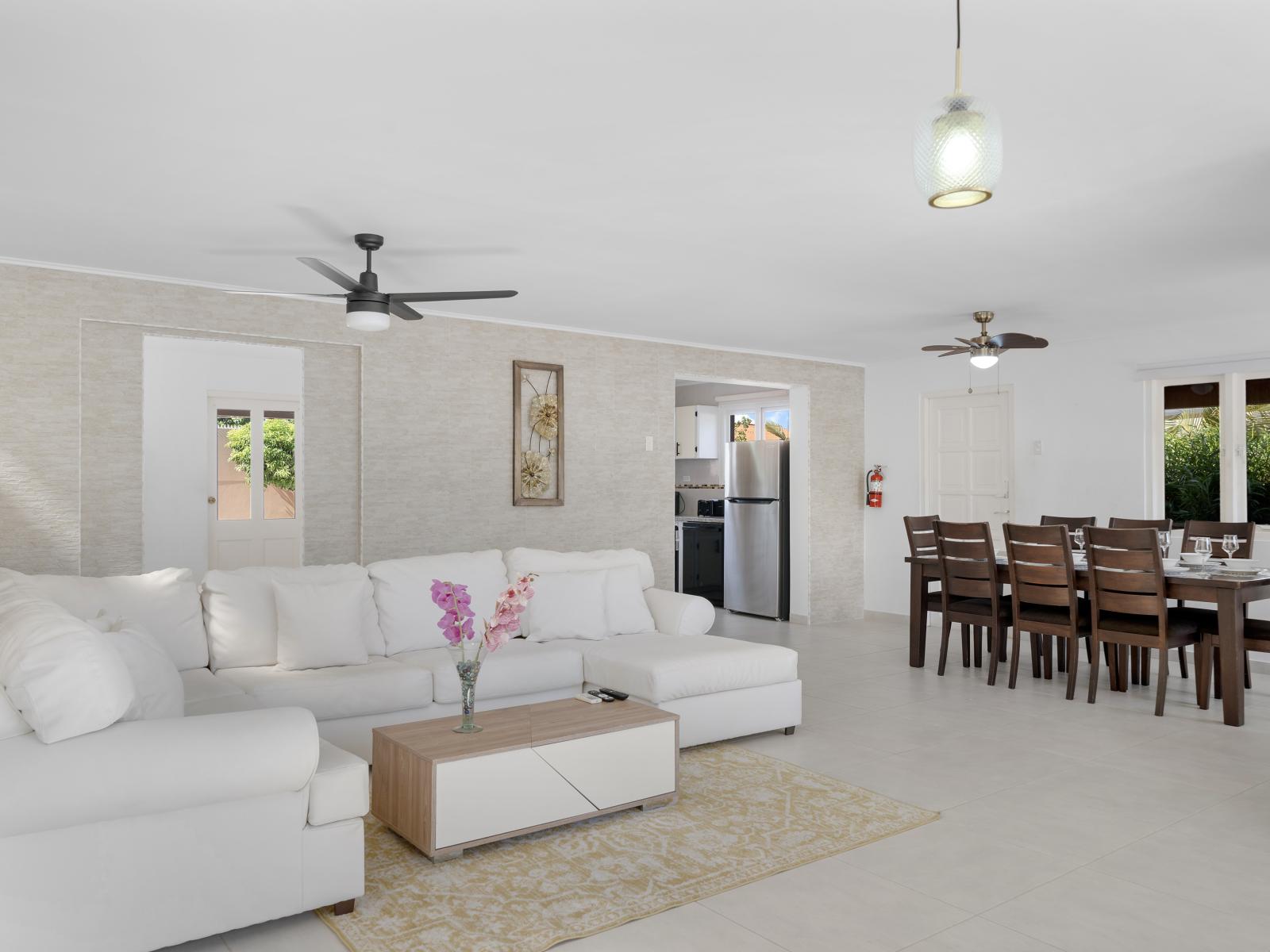 Escape to comfort and style in elegantly furnished living area of the home in Noord Aruba - Beautiful living area with an open layout, creating a sense of spaciousness - Cozy L shape sofa conducive to relaxation and socializing