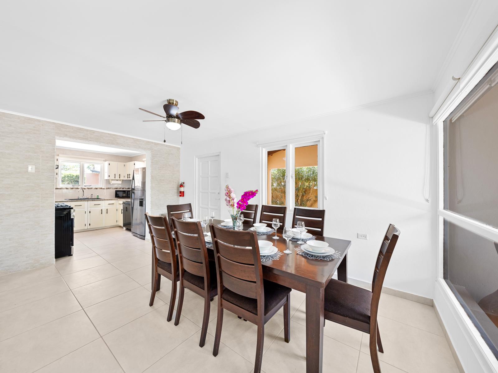 Indulge in culinary delights in this stylish and inviting dining area of the home in Noord Aruba - 8 persons dining table for enjoying delicious meals with family and friends - Understated elegance with a focus on clean lines and sleek design