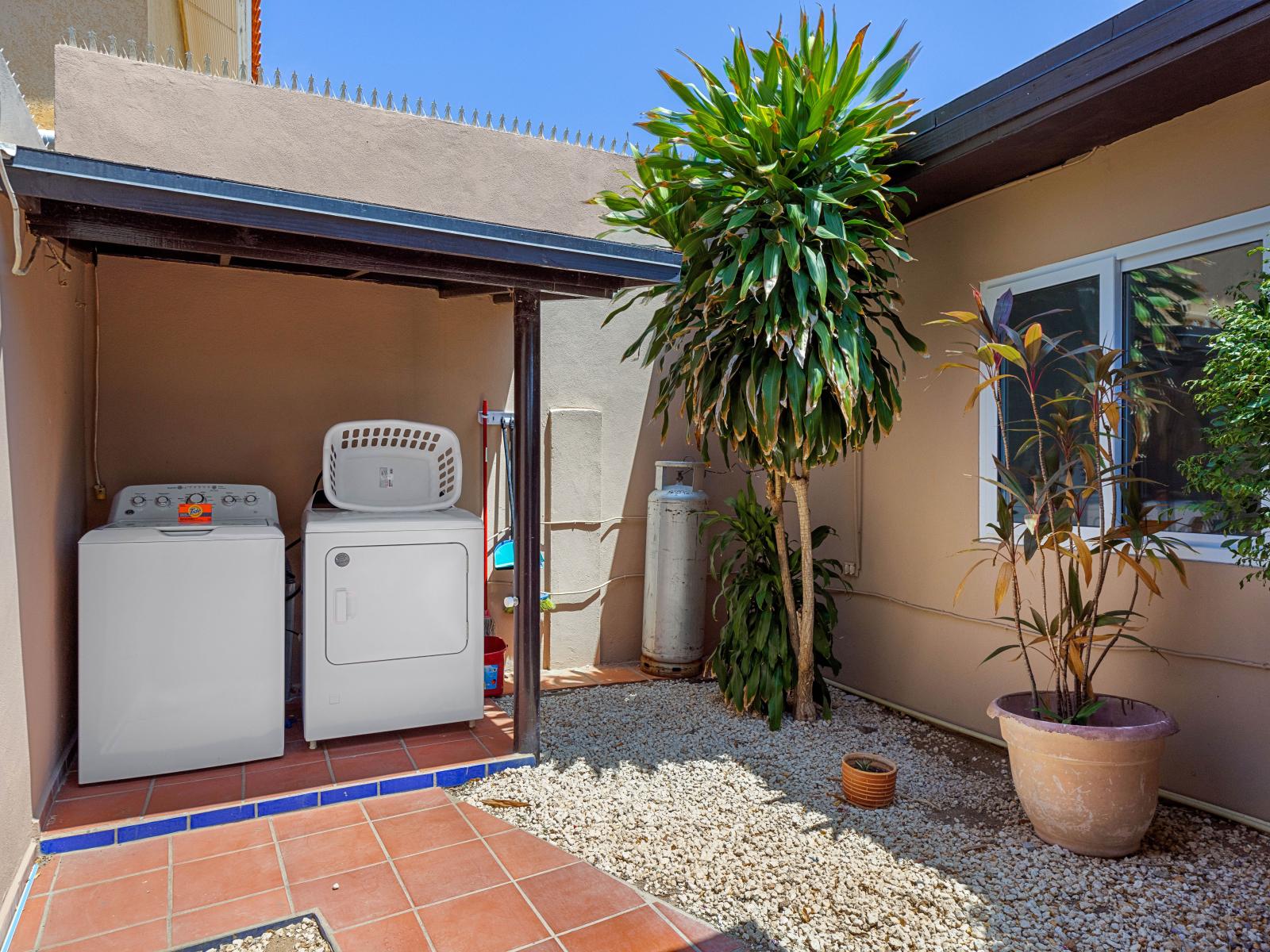 Washer and dryer of the home in Noord Aruba - Enjoy the convenience of home with our fully equipped laundry area - Maintain a fresh wardrobe with our accessible laundry facilities