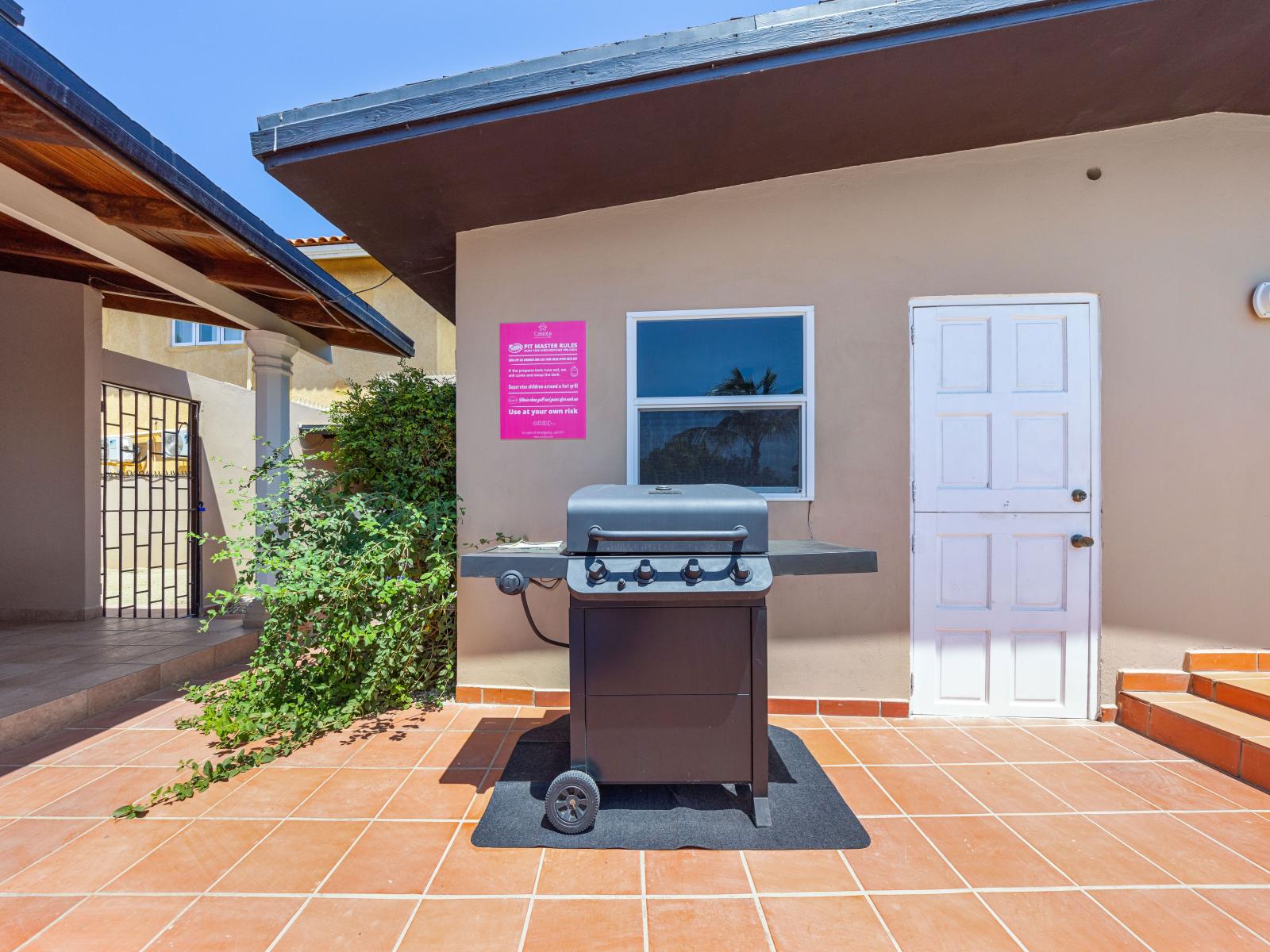 Savor the taste of summer in our inviting BBQ area of the home in Noord Aruba - The perfect spot for enjoying meals al fresco and soaking up the sunshine with loved ones - Grill up your favorite meals and dine amidst beautiful surroundings