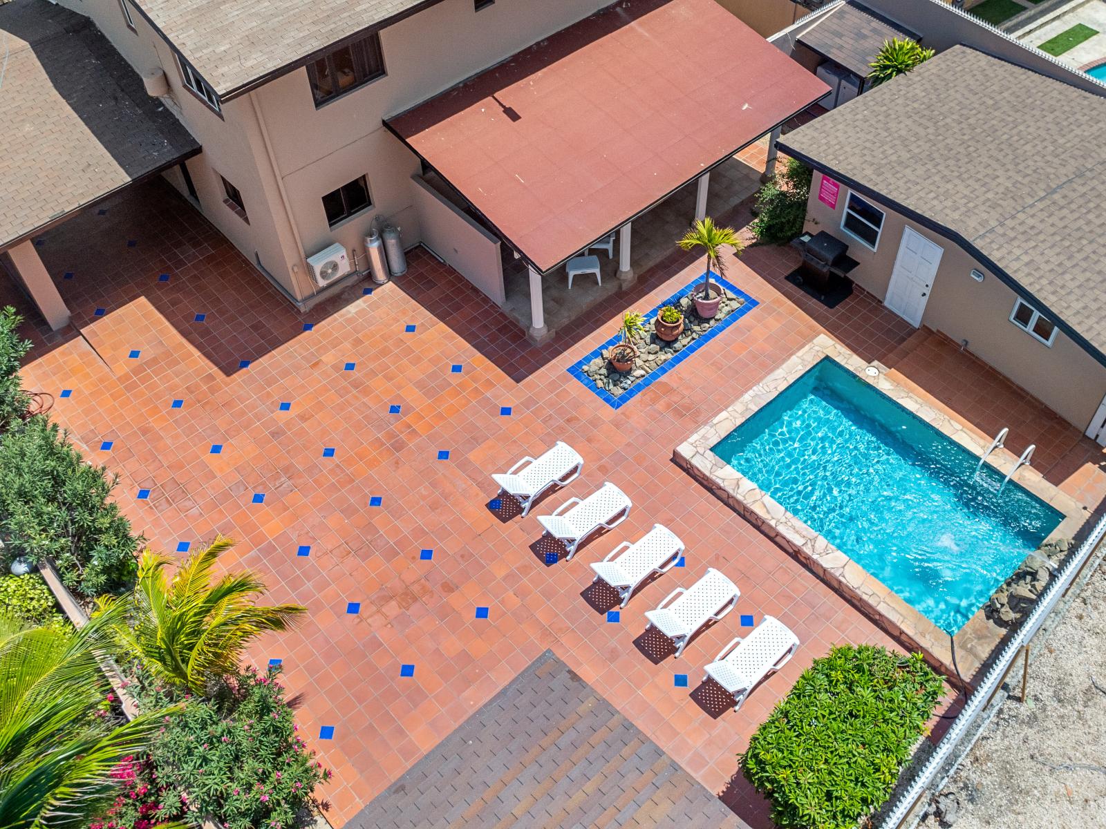 Discover serenity in serene private pool sanctuary of the home in Noord Aruba - Shaded areas for escaping the midday sun and relax - Dive into a refreshing poolside escape and unwind with a dip in