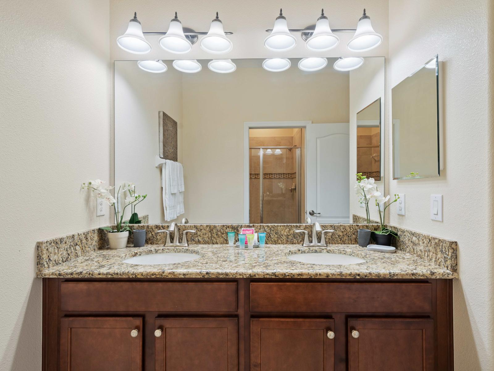 Refresh and rejuvenate in the modern bathroom oasis with dual vanity and upscale lighting - Indulge in a spa-like experience with the luxurious bathroom amenities - Classic and contemporary elements blend harmoniously throughout