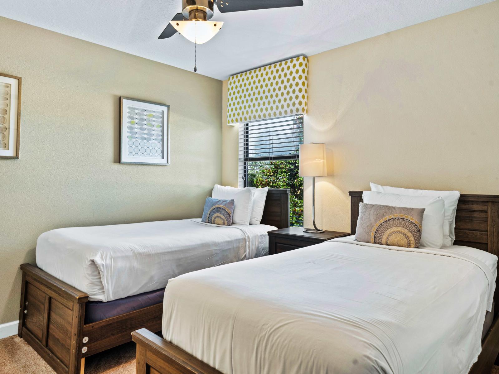 Enjoy sweet dreams in our plush and inviting bedroom, designed for comfort - Featuring twin single beds, a peaceful ambiance perfect for relaxation and rejuvenation - Attached bathroom for added comfort and convenience for your stay