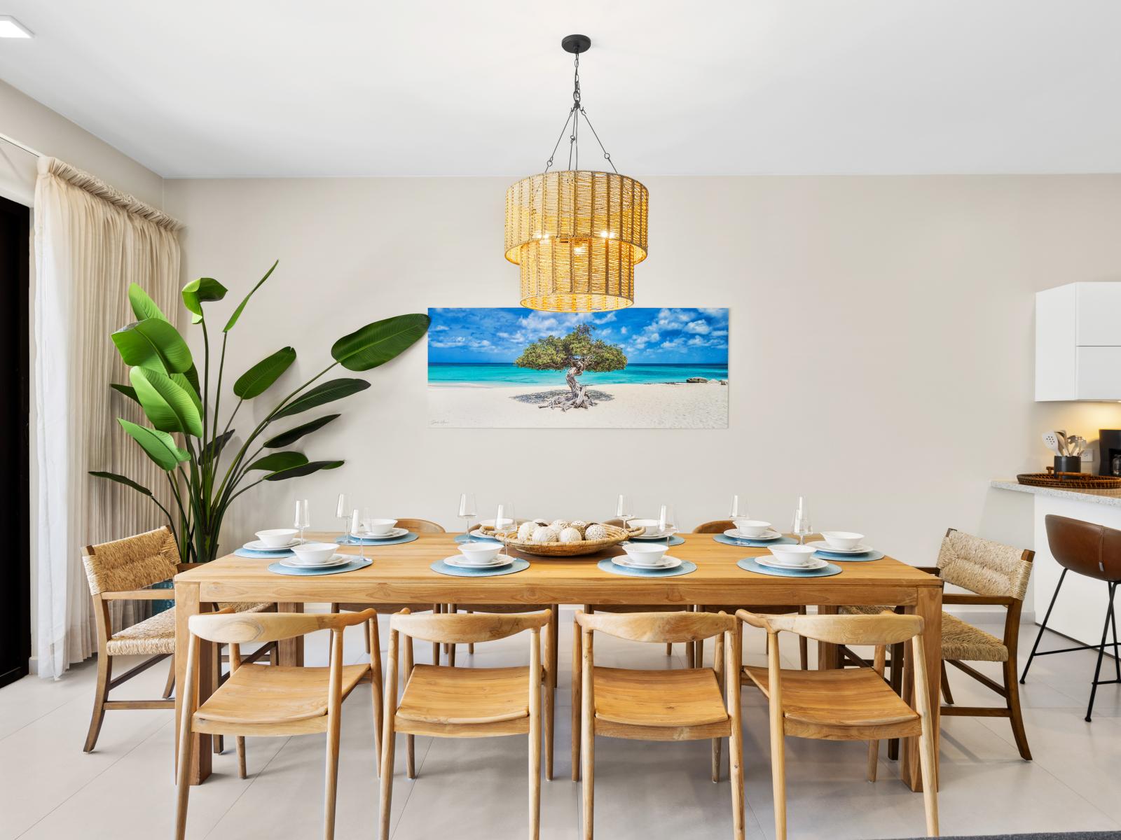 Gather and dine in style at elegant dining area of the apartment in Noord Aruba - Every meal becomes a memorable occasion, featuring dining for 10 persons - Designed for comfort and conviviality with easy access to kitchen and the outdoors