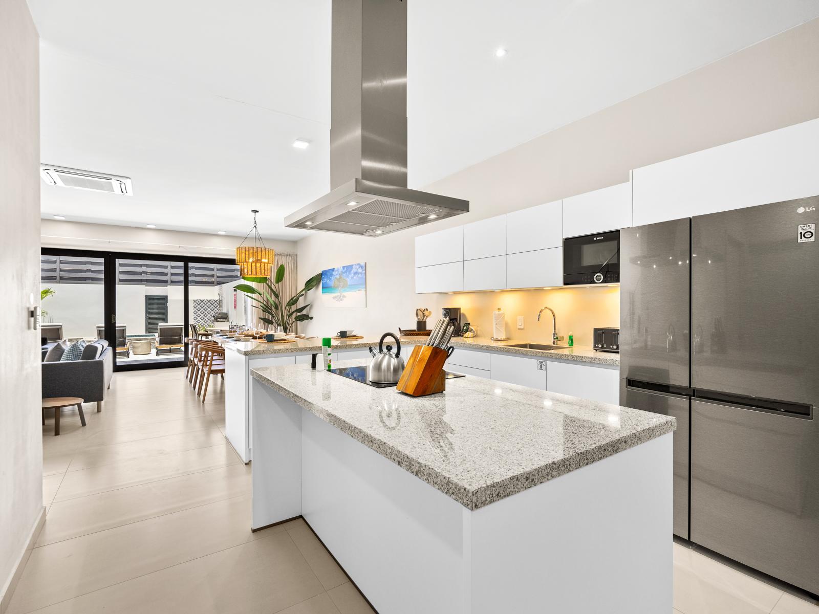 Indulge your inner chef in fully equipped kitchen of the apartment in Noord Aruba - Featuring modern stainless steel appliances and plenty of space for culinary creations - An open-concept layout and spacious countertops for meal preparation