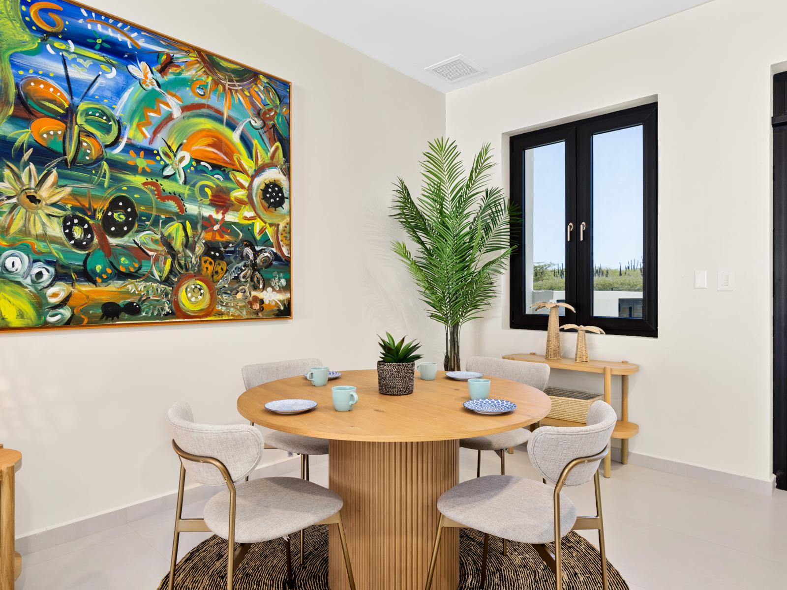 Experience the joy of shared meals in casual dining space of the apartment in Noord Aruba - Designed for comfort in elegant surrounding with chic decor and lively ambiance -  Enjoy the dining for four persons, located near the entrance