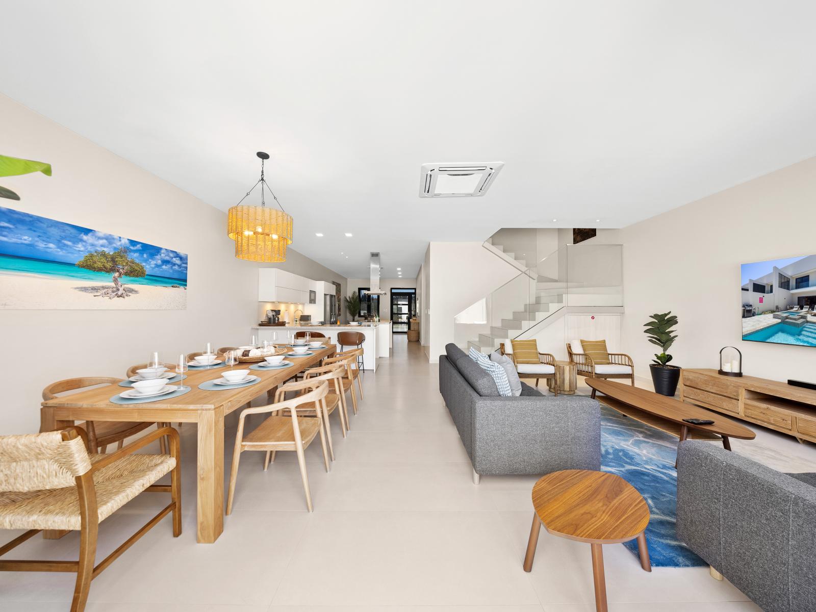 Savor the convenience of open concept layout of the apartment in Noord Aruba - The living and dining seamlessly merge, providing space for both relaxation and entertainment -  Stylish furnishings and thoughtful design, create a welcoming ambiance