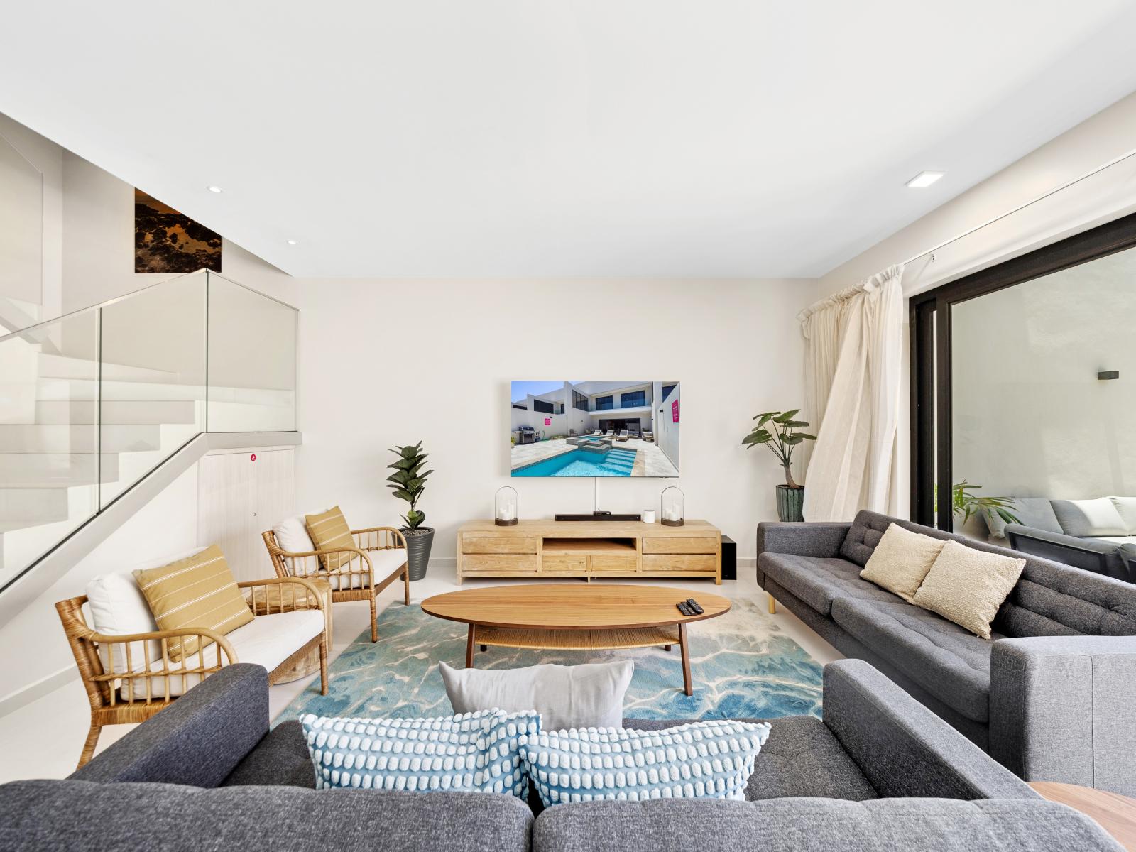 Enjoy the perfect blend of style and comfort in contemporary living area of the apartment in Noord Aruba - Space designed for relaxation and rejuvenation with upscale amenities  -Stylish yet comfortable seating arrangements for lounging