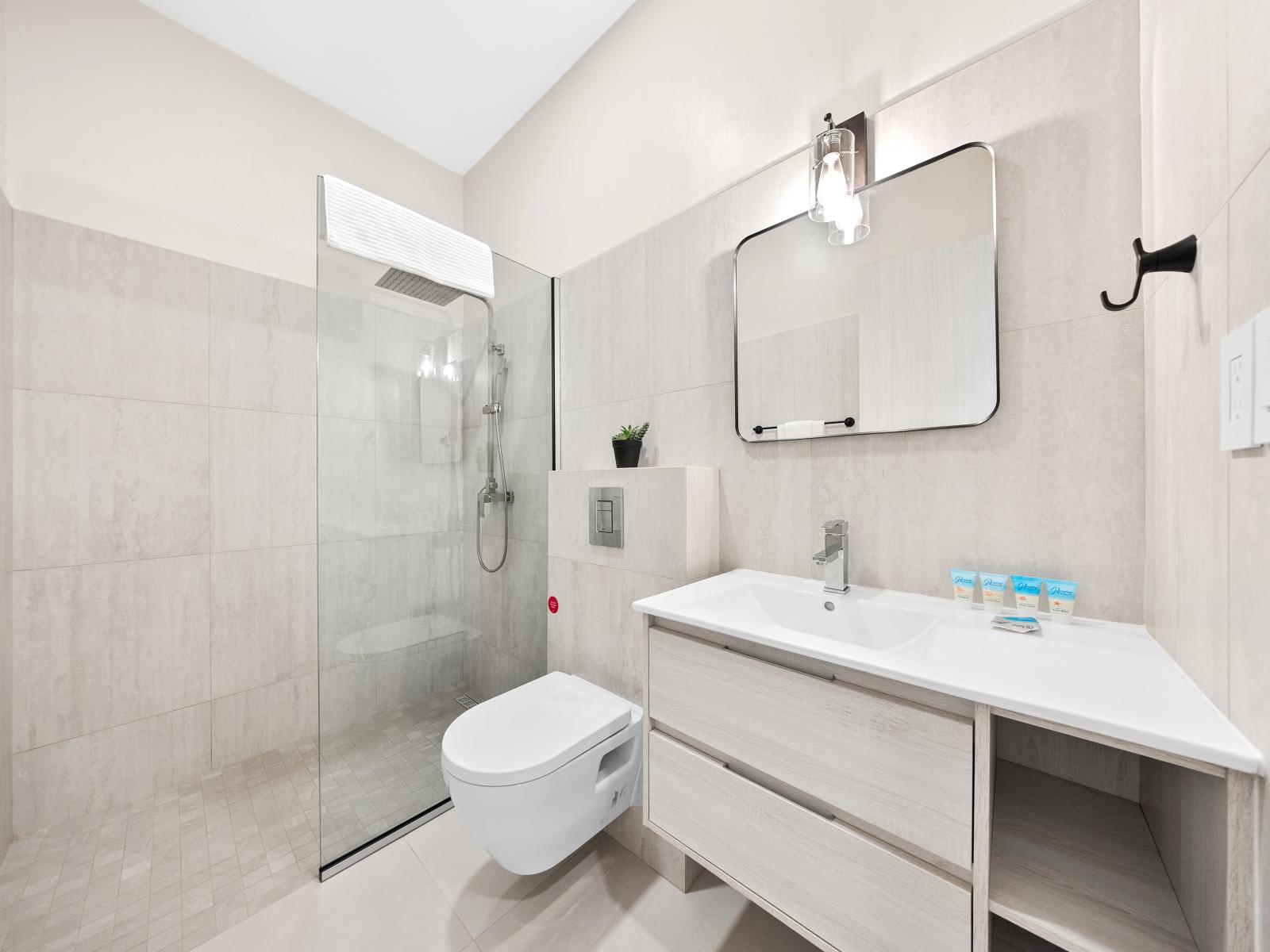 Step into luxury in exquisite bathroom of the apartment in Noord Aruba - Elegant design and convenient amenities create a serene retreat for you to relax - Glamour meets functionality with carefully selected fixtures and spacious walk-in shower