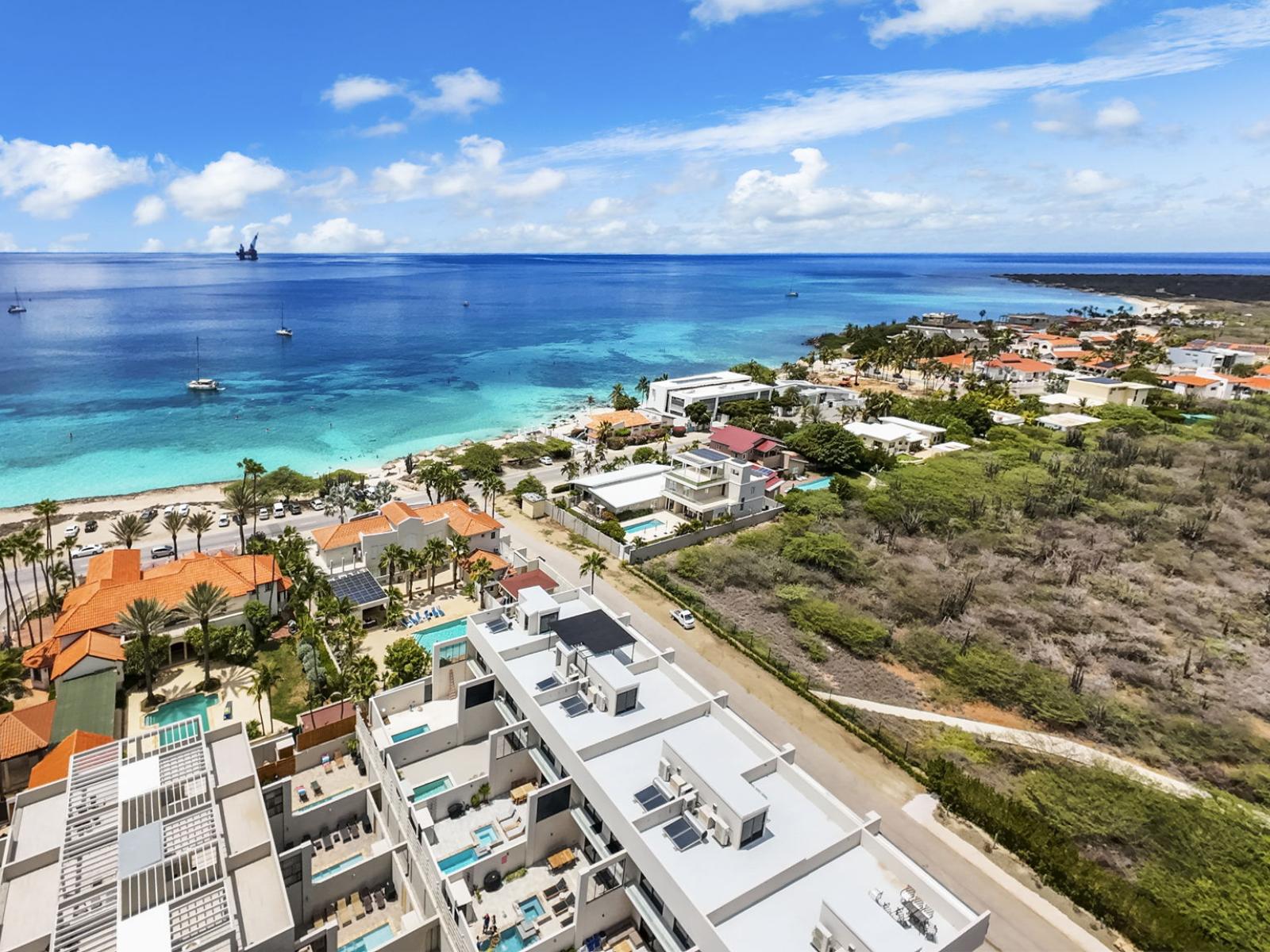 The apartments, harmoniously integrated into the lush natural surroundings