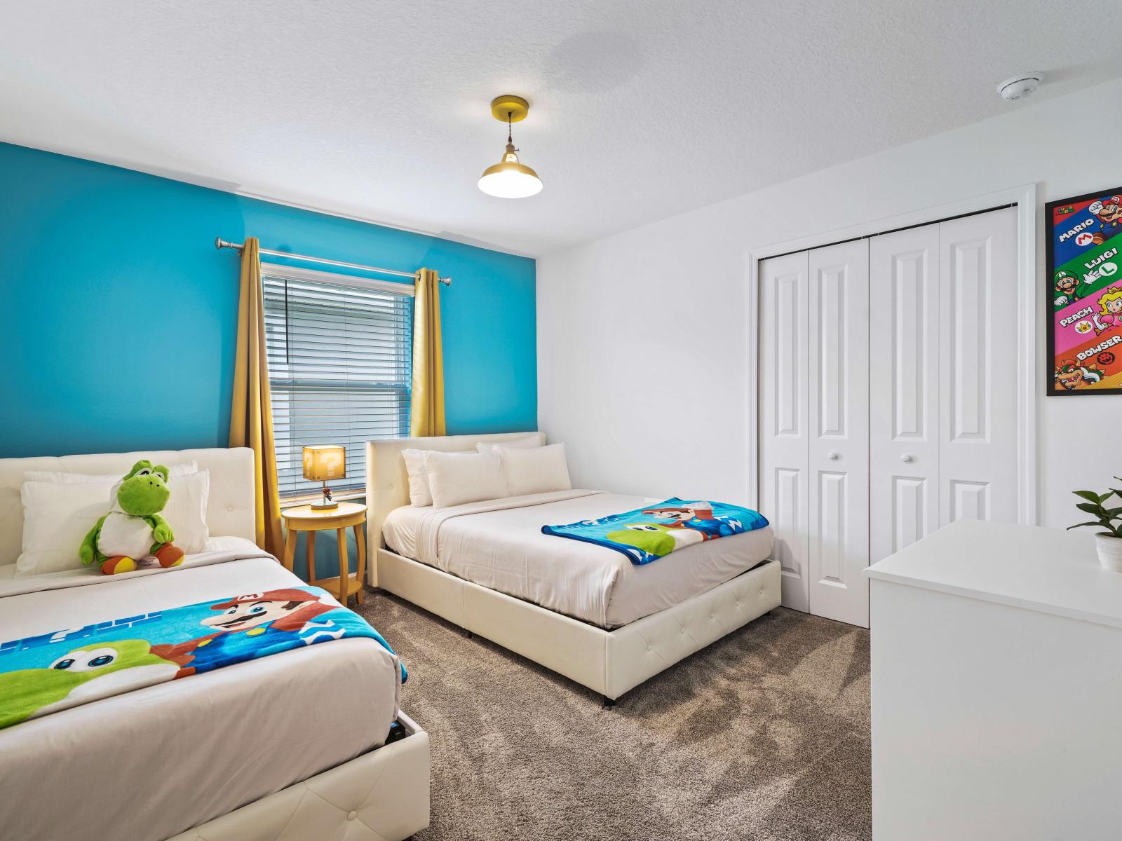 Find solace and tranquility in beautifully crafted bedroom of the townhouse in Davenport Florida - Featuring one double bed and one single bed to relax after the day of adventure - Thoughtfully designed for comfort and style with Super Mario decor