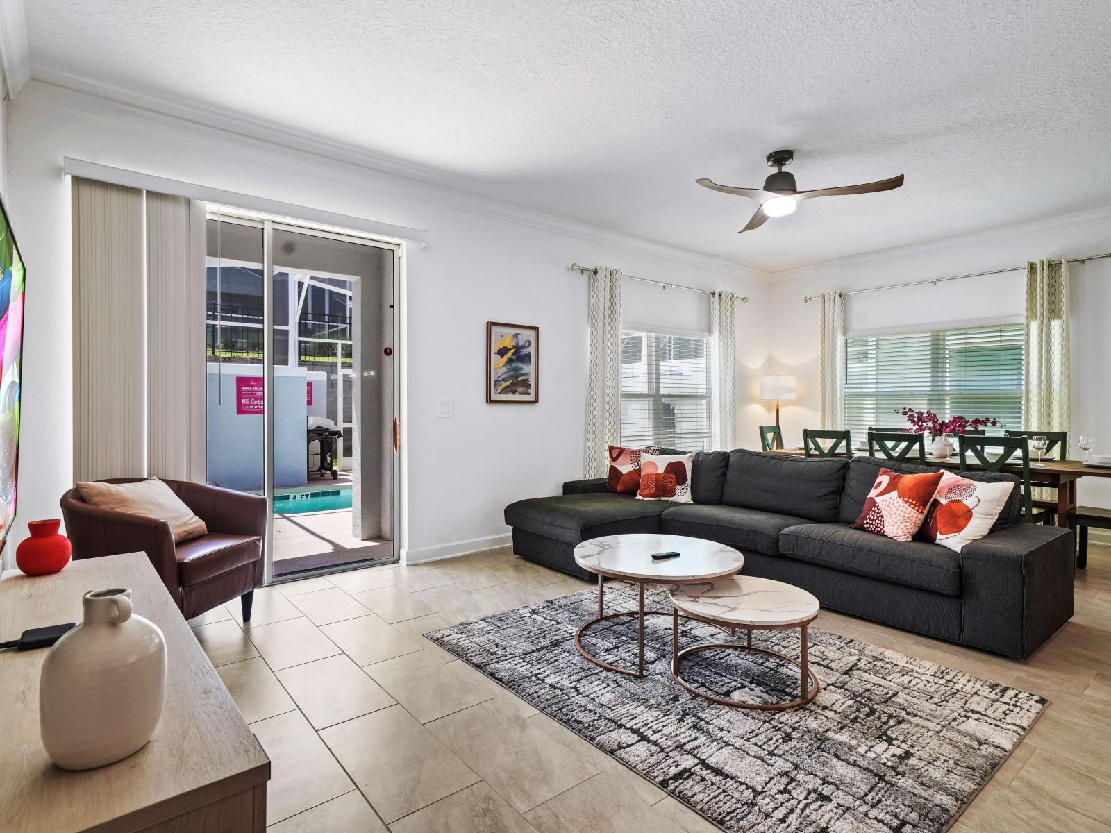 Elevate your stay with the perfect balance of luxury and relaxation in chic living area of the townhouse in Davenport Florida - Elegantly decorated space with a neutral color palette for a timeless appeal - Cozy seating conducive to relaxation