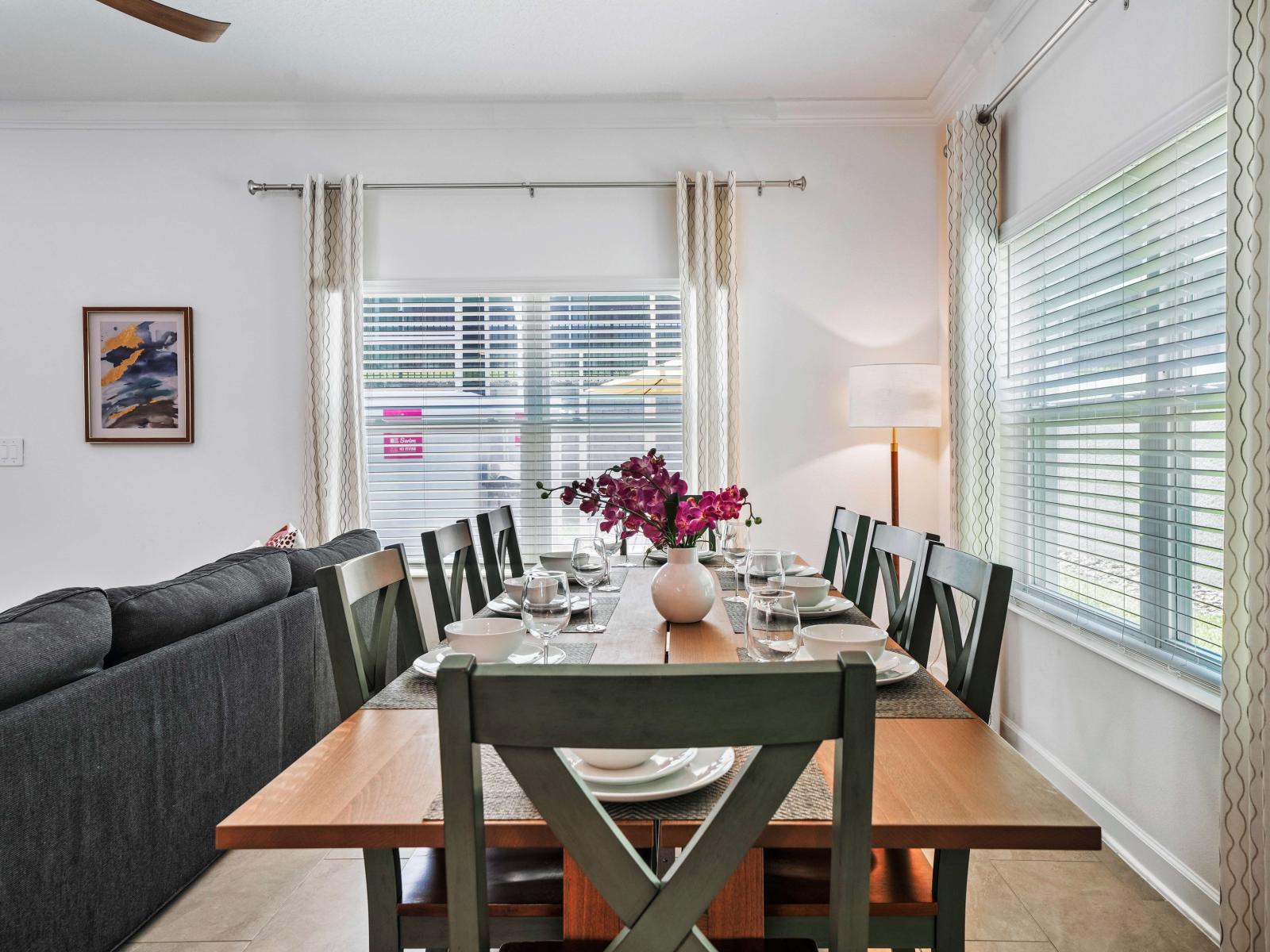 Experience gourmet dining in a beautifully appointed dining area of the townhouse in Davenport Florida - Harmonious color scheme for a cohesive and stylish look - Where every meal becomes a cherished memory