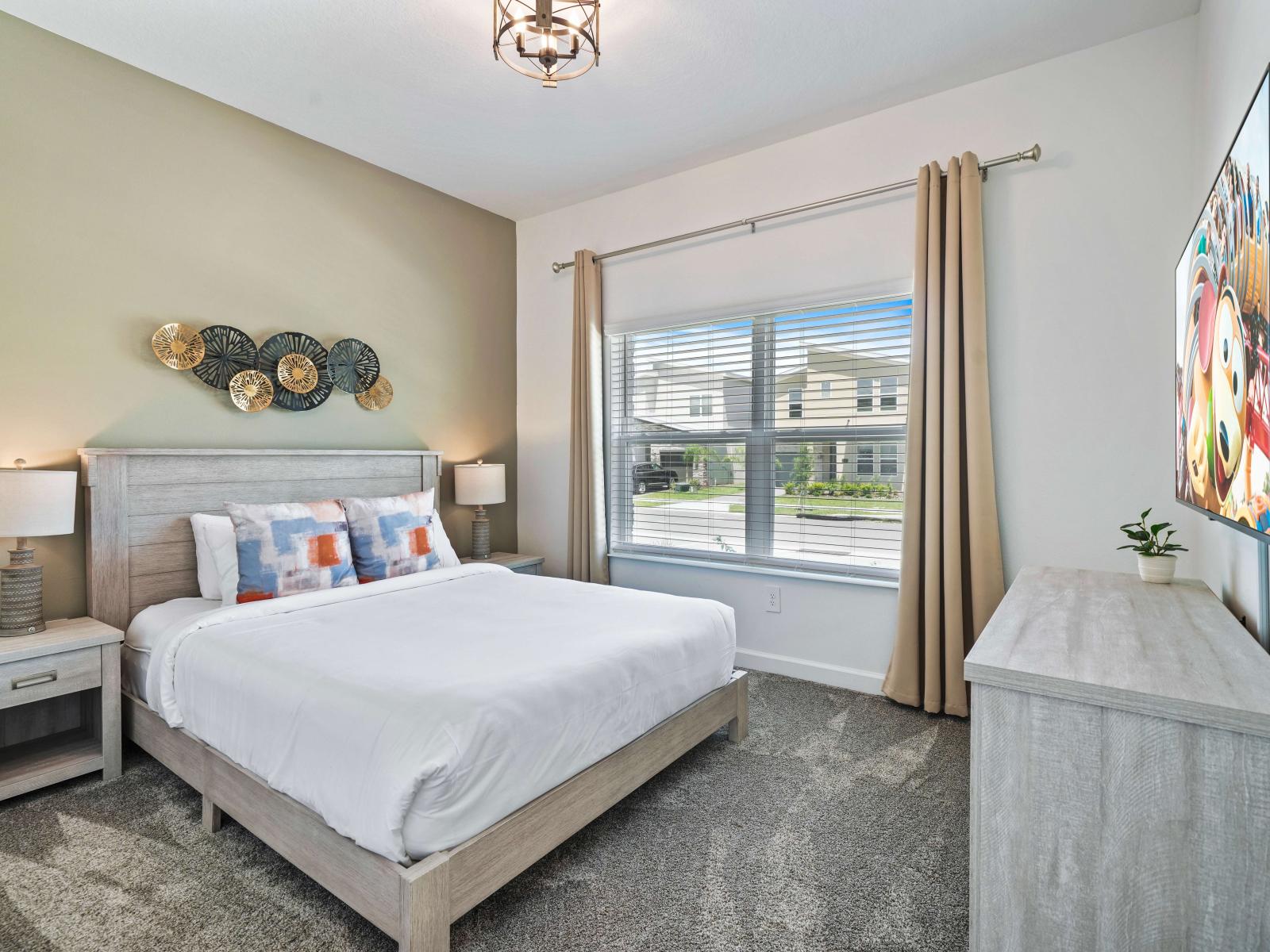 Experience the perfect night's sleep in comfy and inviting bedroom of the townhouse in Davenport Florida -  With a queen size bed and smart TV, a haven of relaxation during your stay - A serene escape where you can indulge in ultimate comfort