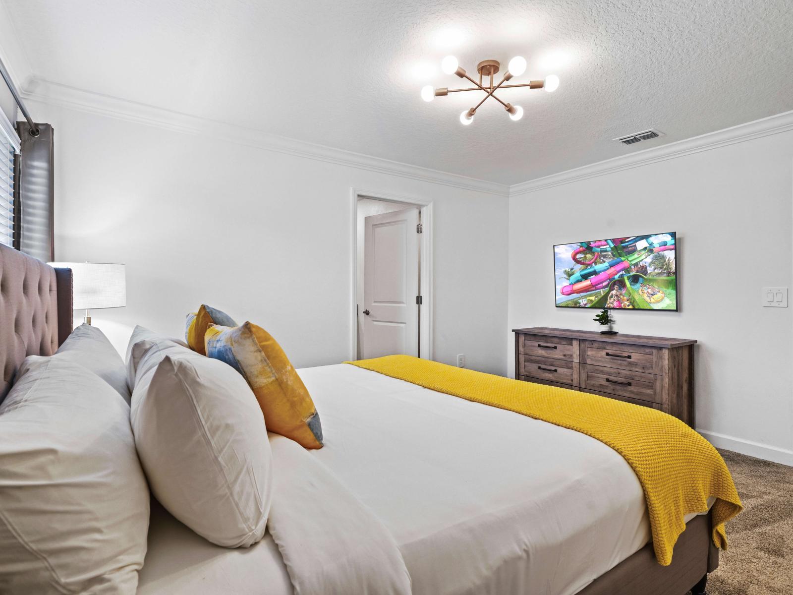 Experience a peaceful night's sleep in comfortable bedroom of the townhouse in Davenport Florida - With a king size bed and private bathroom for added convenience - Bedroom with a cozy ambiance, blending comfort and aesthetics