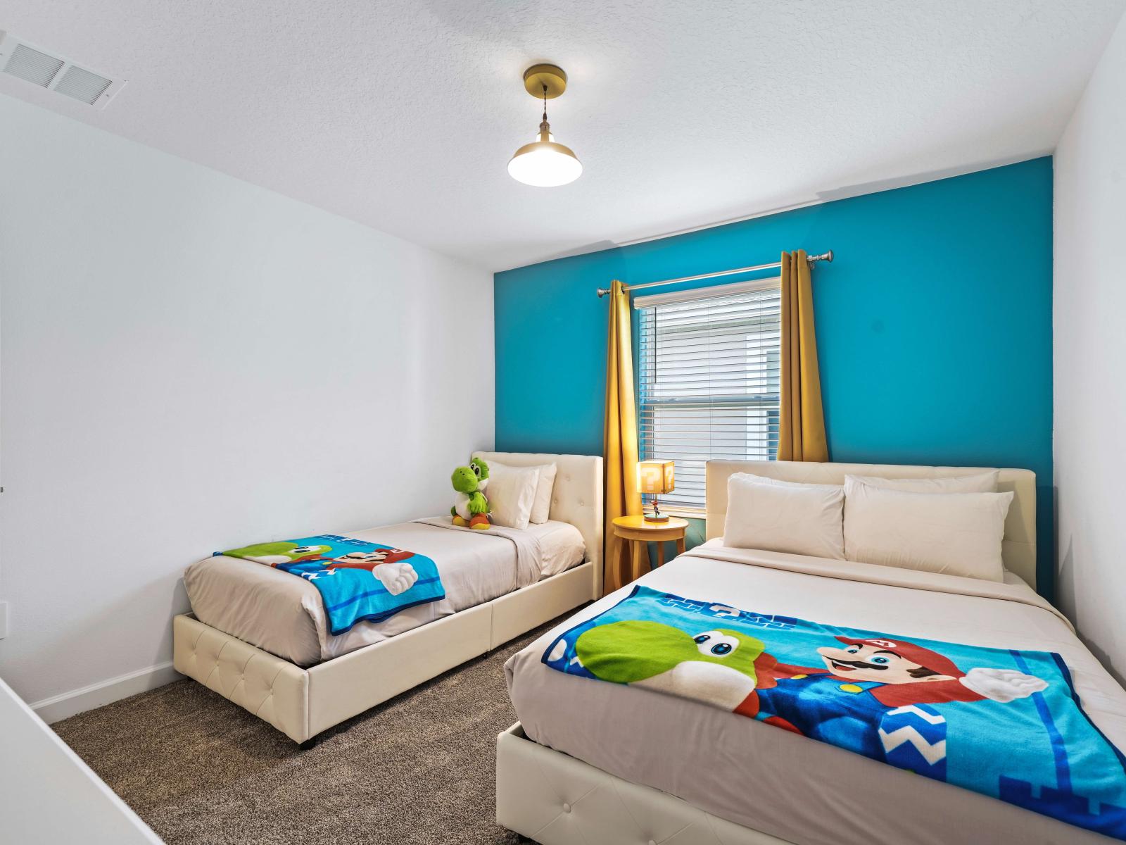 Escape to tranquility in a Mario decorated bedroom of the townhouse in Davenport Florida - Harmonious color palette creating a soothing atmosphere and plush bedding - Offering one double and one single bed with a smart TV