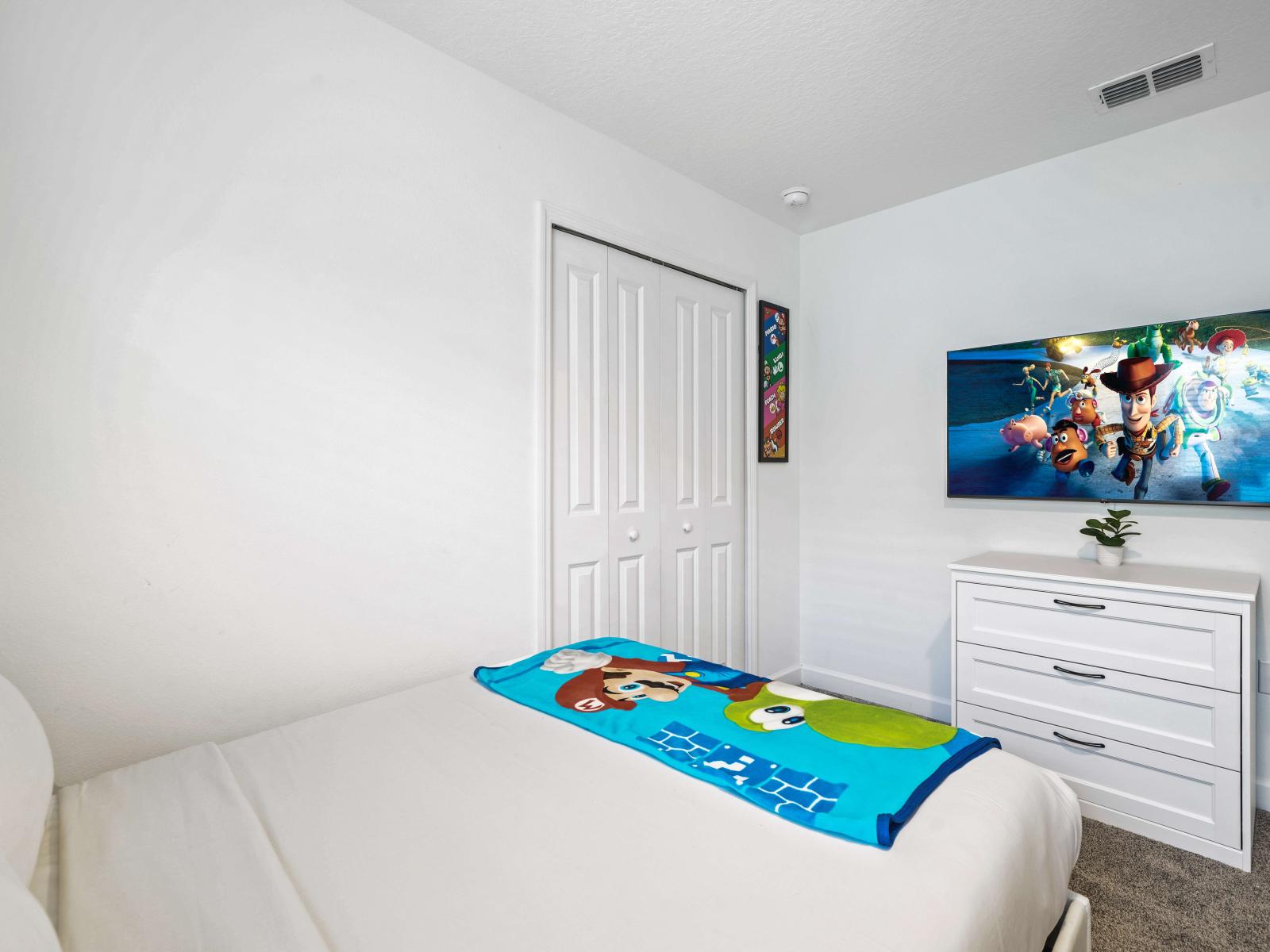 Discover the perfect blend of comfort and style in serene bedroom of the townhouse in Davenport Florida - Thoughtfully designed space featuring functional and stylish furniture - Offering flat screen smart TV, one double bed and one single bed