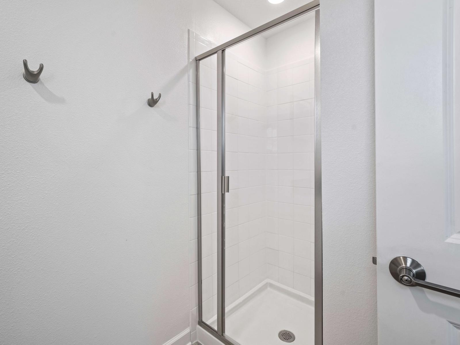 Discover the art of relaxation in a spa-inspired bathroom of the townhouse in Davenport Florida - Your private sanctuary with spacious shower stall - Escape to serenity in a beautifully appointed bathroom, the perfect place to unwind