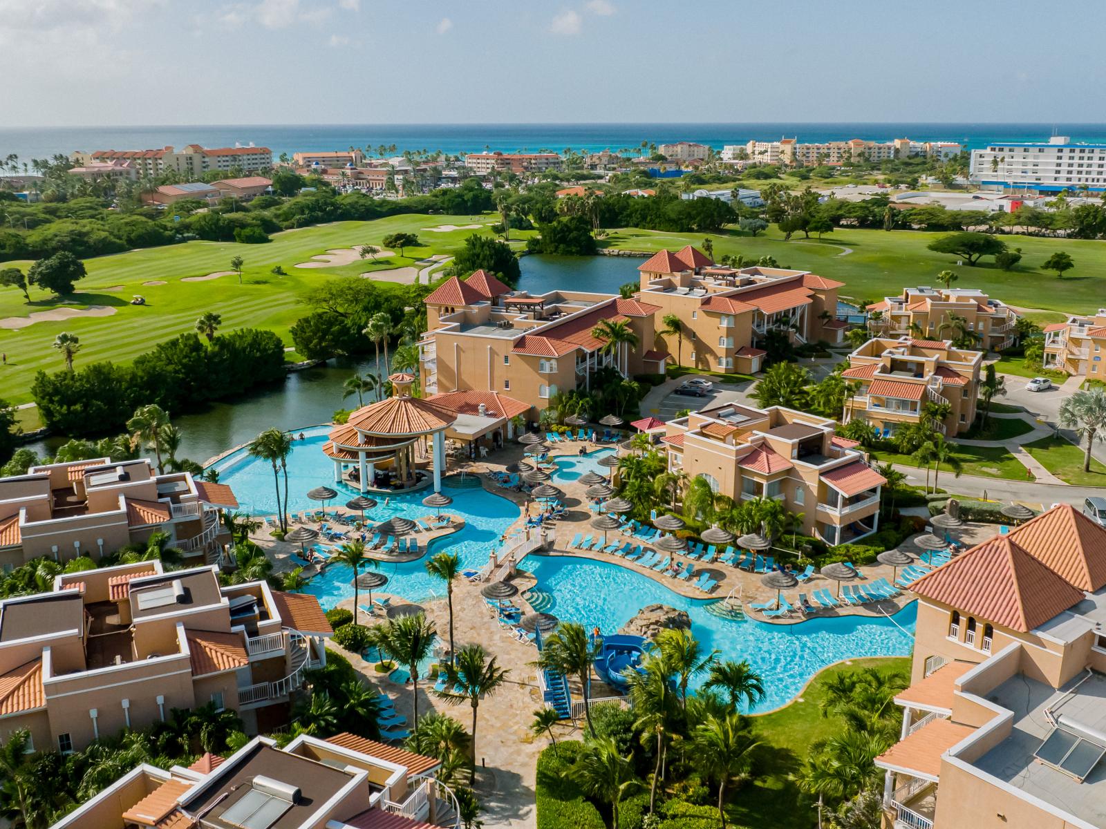 Divi Village Resort Infinity Pool and golf course, with the beach in the background