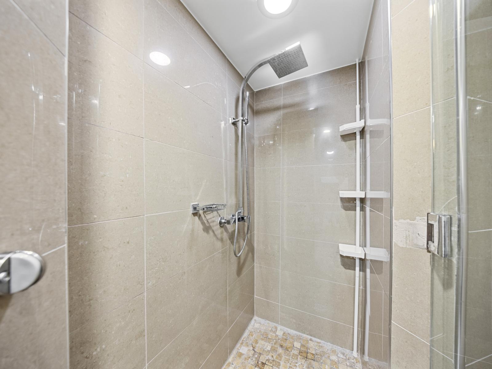 Refresh and renew in the second bedroom's bathroom, featuring a sleek walk-in shower for your comfort.