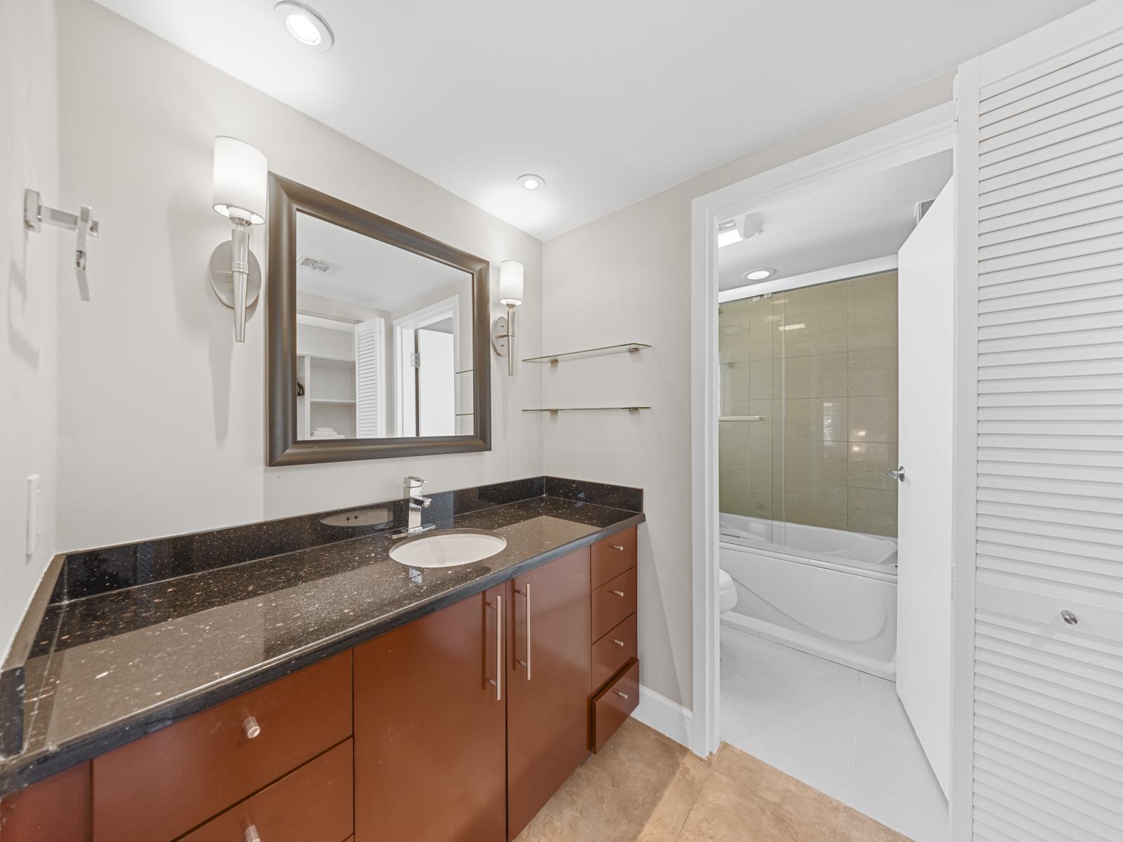 Enjoy the clean lines and contemporary style of the fourth bedroom's private bathroom