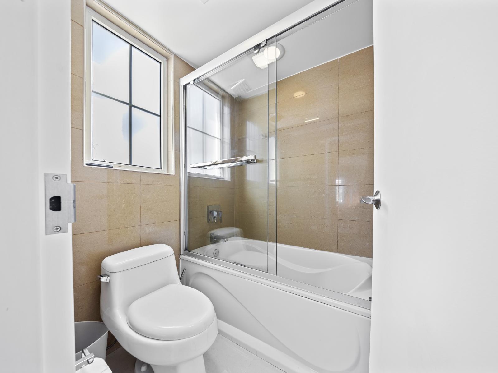 Experience comfort and convenience in the fourth bedroom's private bathroom, complete with modern fixtures.