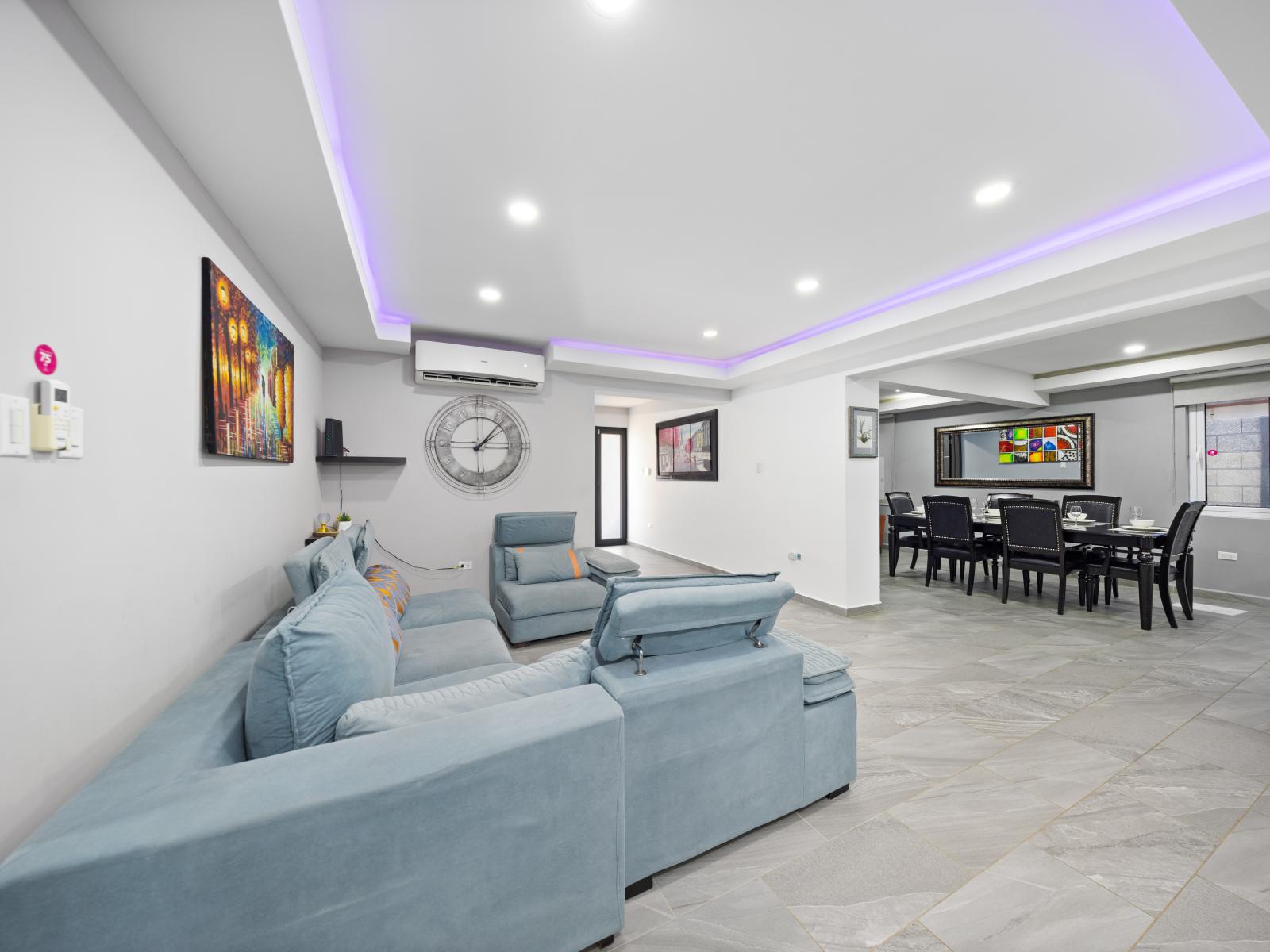 Enjoy ease of interaction in the open concept living and dining area of the home in Aruba - A welcoming space where you can create cherished memories with loved ones - A serene ambiance perfect for unwinding after a day of adventure