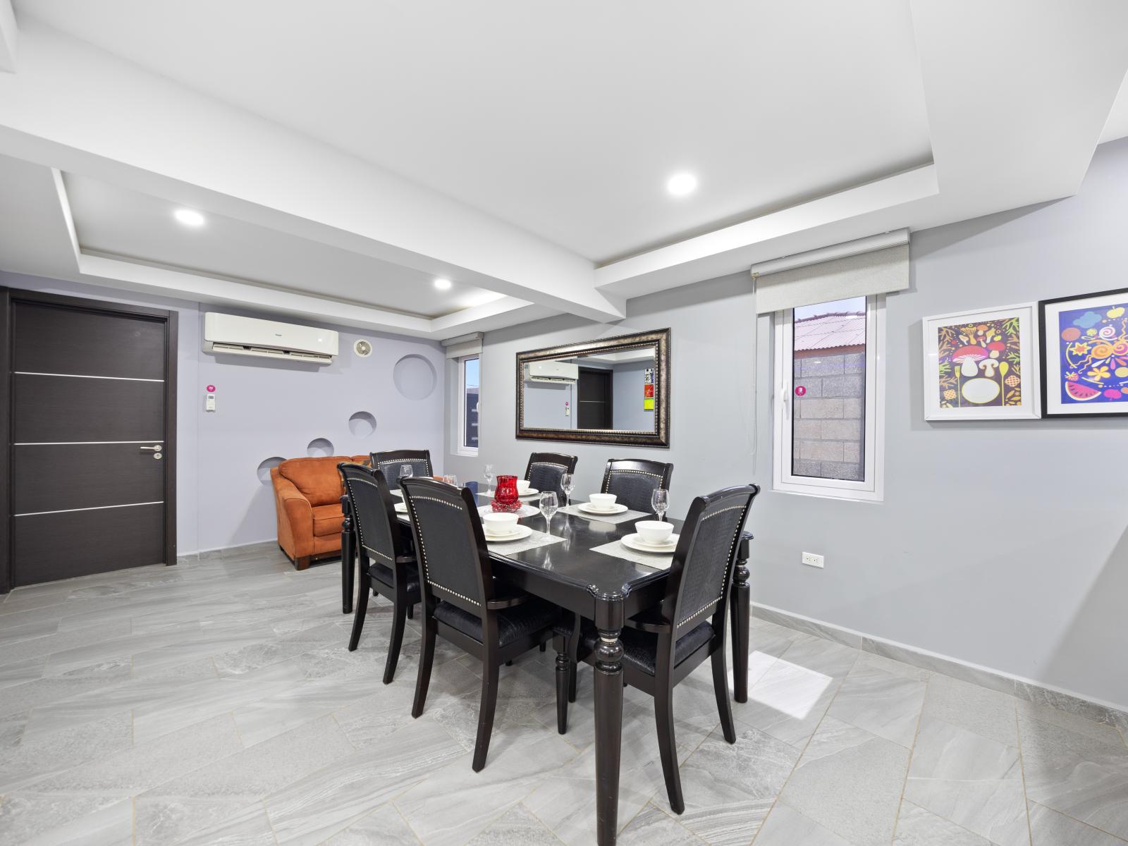 Step into elegance in this stylish dining area of the home in Aruba - Offering dining for 6 persons, where meals become memorable moments - Entertain in style in this sophisticated dining area, a setting for unforgettable dinners