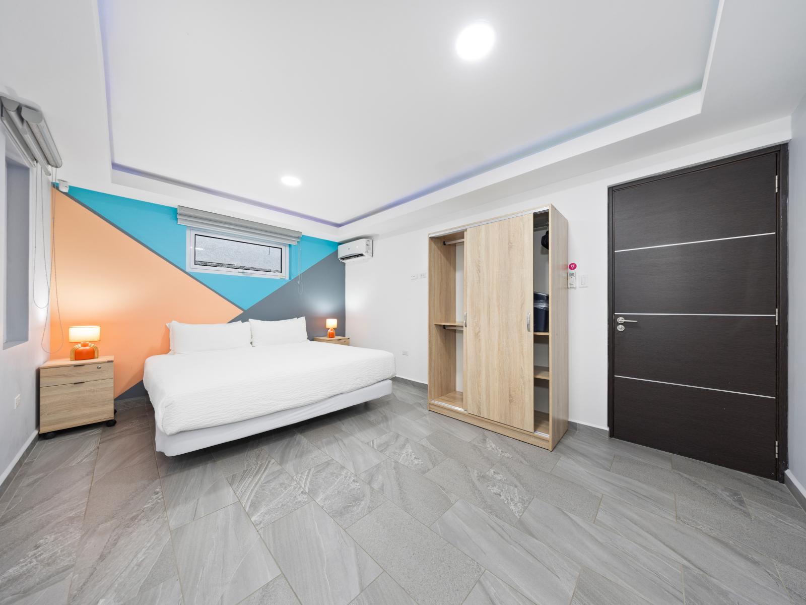 Enter into luxury with this meticulously designed bedroom of the home in Aruba - Offering a king size bed, large closet with sliding doors and smart TV, a haven of comfort and style - Modern and stylish decor that complements the space