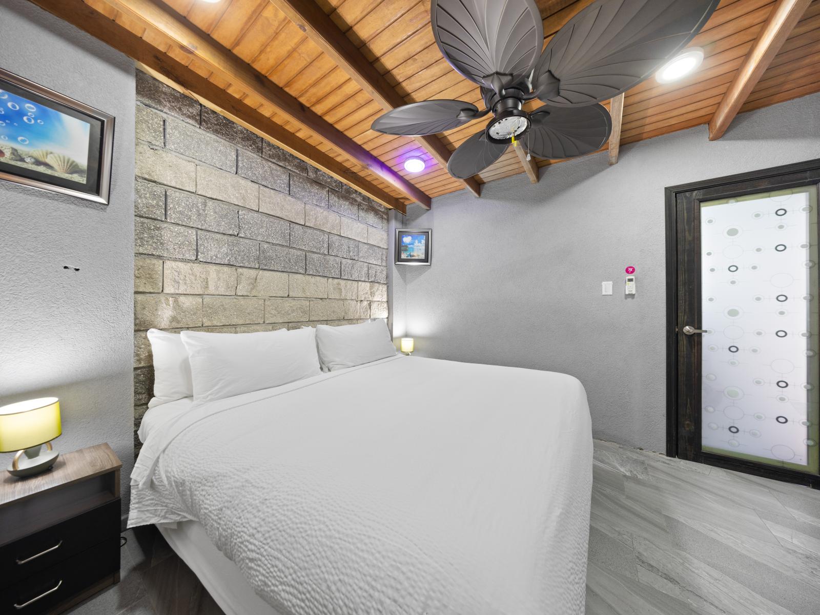 Experience the ultimate in relaxation in serene bedroom of the home in Aruba - Cozy retreat with a plush king size bed, perfect for relaxation - Privacy is the key here, located on a separate apartment for added convenience