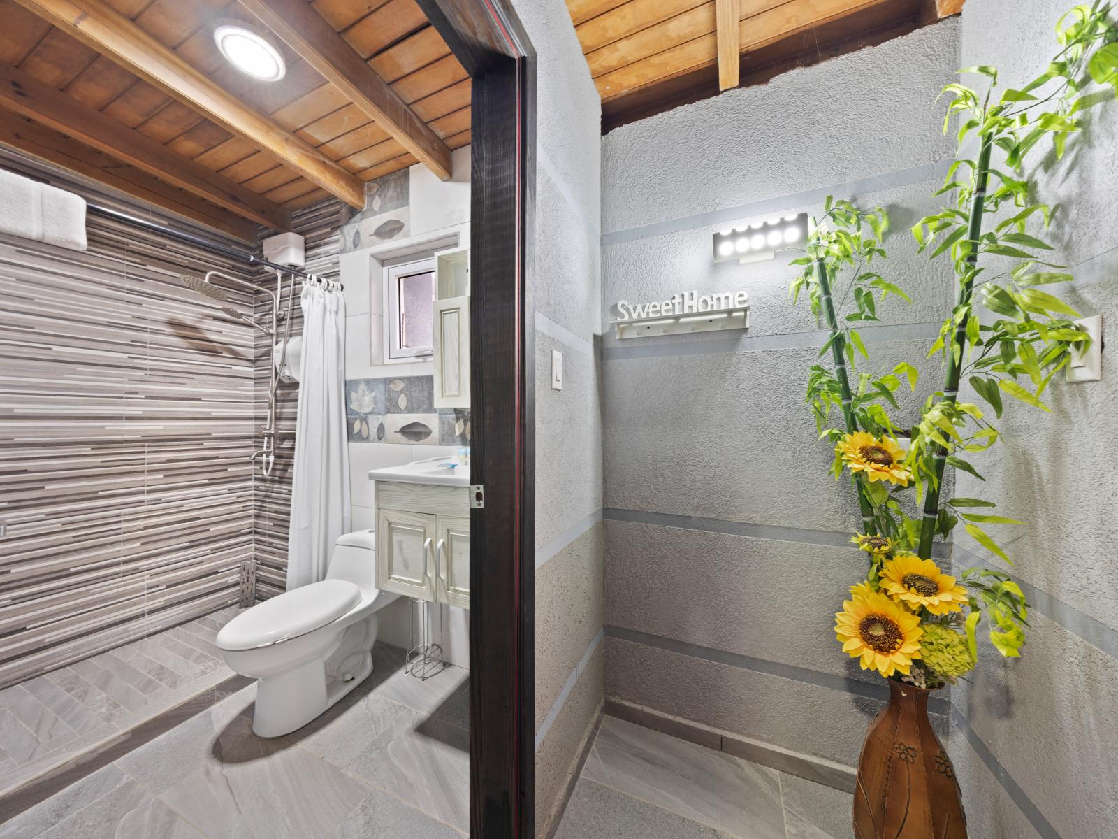 Experience luxury in this meticulously designed bathroom of the home in Aruba - Offering a spacious walk-in shower stall, a tranquil retreat for pampering and recharging - Entertain dreams in this elegant bathroom, a serene sanctuary after long day