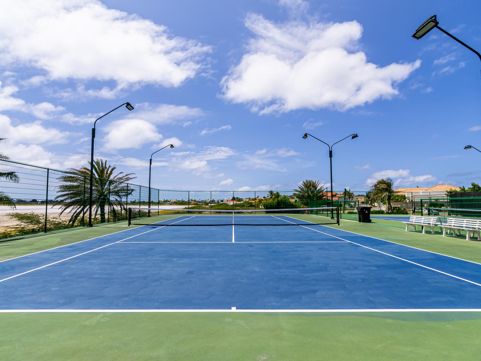 - Enjoy a match on our resort's well-maintained tennis court in Noord, Aruba. - Stay active and entertained with a game of tennis on our resort's pristine court. - Challenge your friends with a game of tennis on our resort's tennis court.