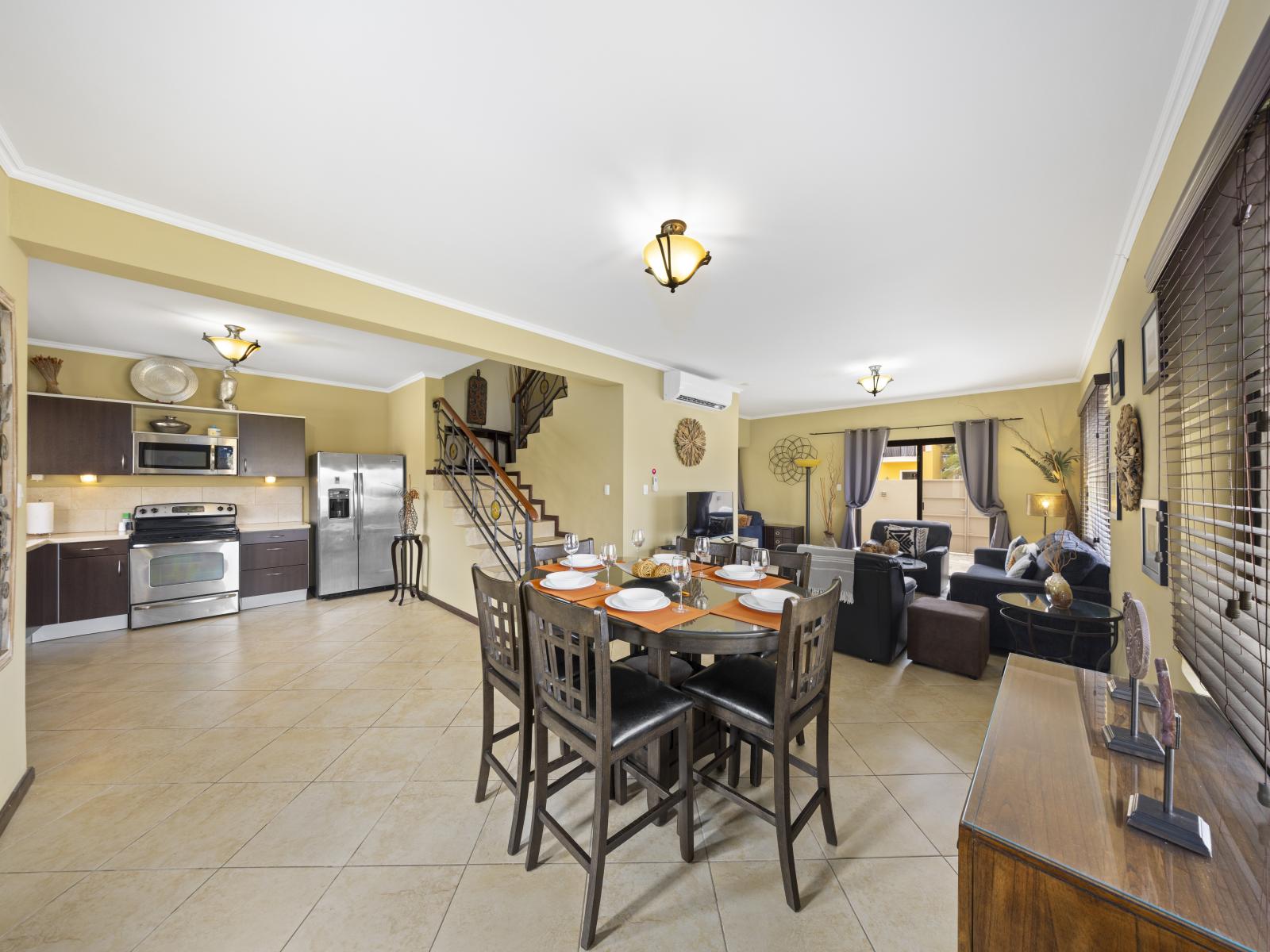 - Immerse yourself in the inviting dining space of the Noord, Aruba townhouse. - Cherish intimate occasions and delightful meals in the snug dining ambiance. - Forge enduring memories during family gatherings in the hospitable dining area.