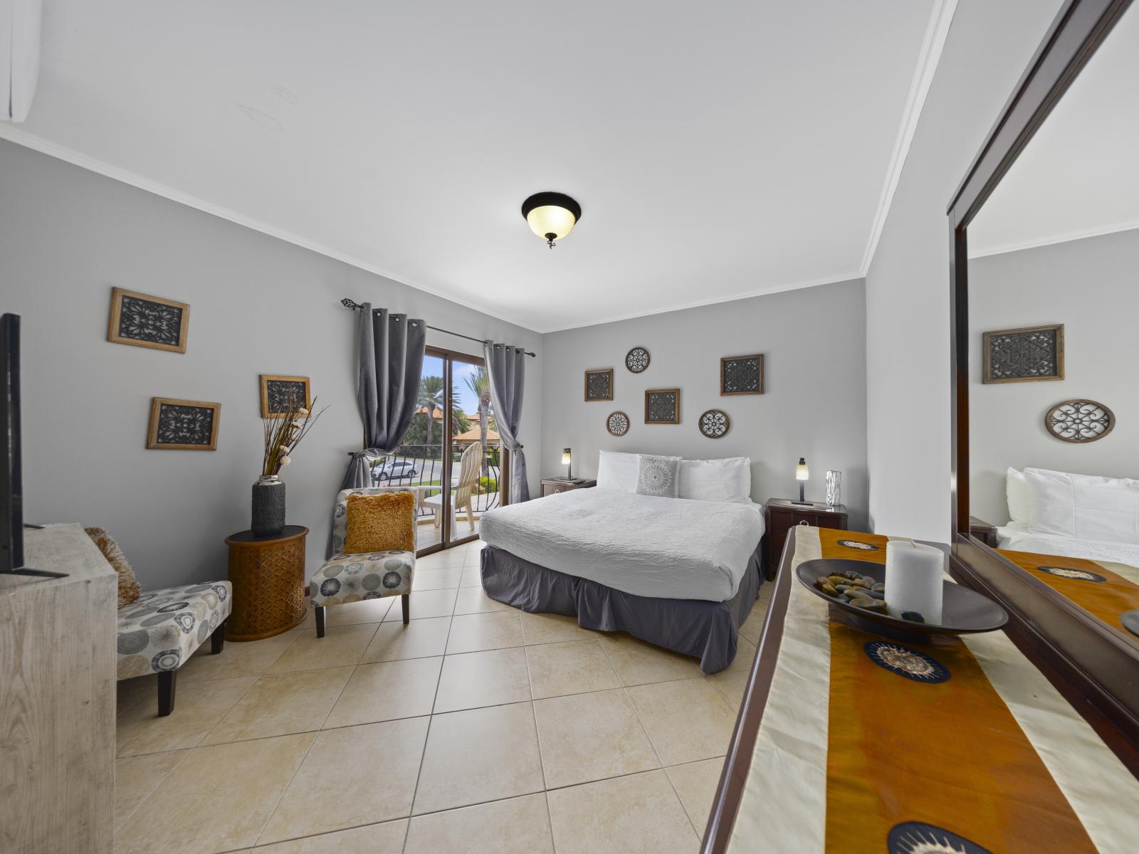 - Experience the perfect blend of comfort and beauty in the bedroom of the townhouse in Noord Aruba - The bedroom features a double bed with neat and clean linen and soft pillows - Elegant lighting for a restful night's sleep - Smart TV available