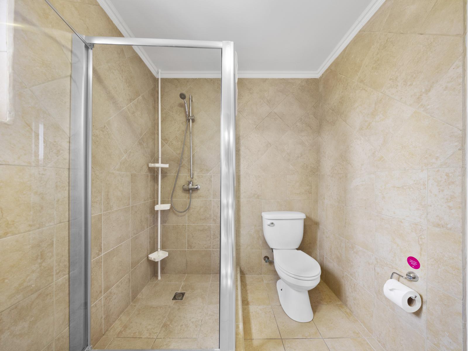 - Our refreshing bathroom of townhouse features a contemporary design in Noord, Aruba - Boasting a refreshing, neat and clean toilet seat - Stunningly appointed glass enclosed shower area - Enjoy the availability of fresh towels throughout the stay