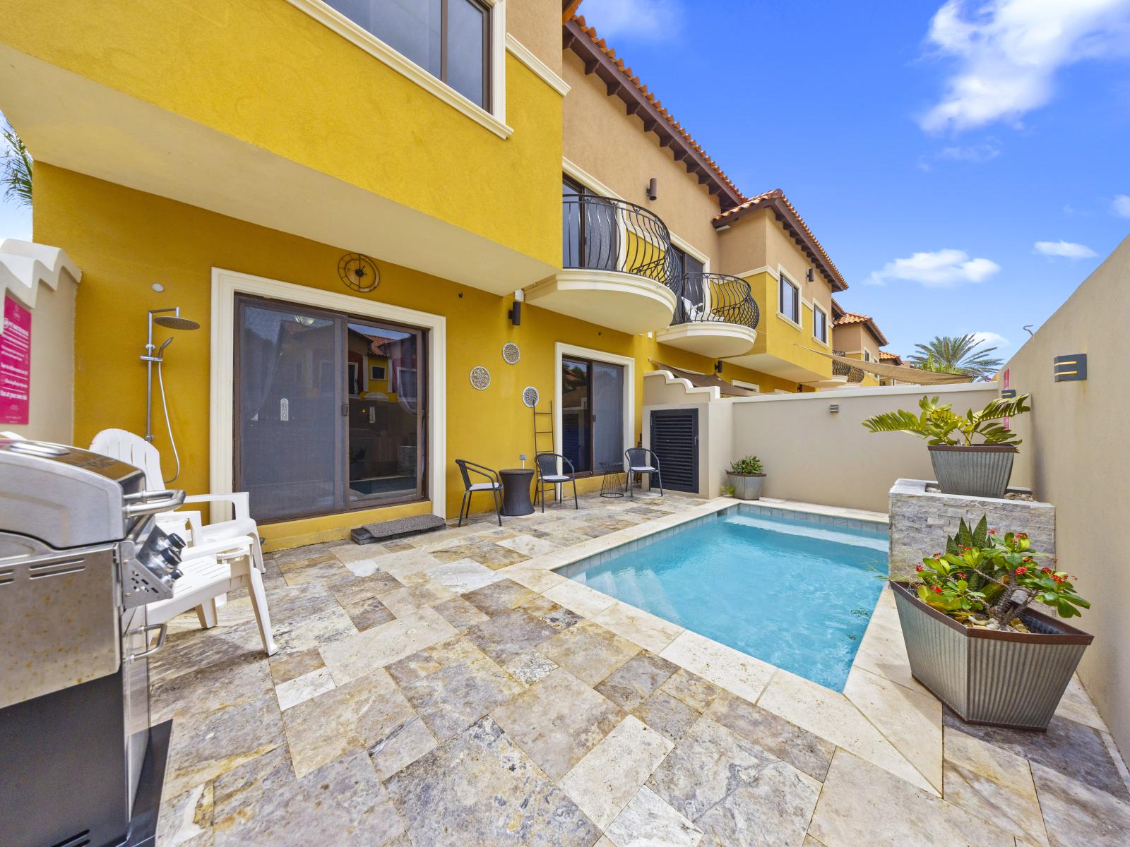 - Take a refreshing swim in the pristine, shared pool of our townhouse in Noord, Aruba. - Enjoy ultimate relaxation by the poolside, complete with lounge chairs and a BBQ Grill. - The pool area is perfect for gathering and creating lasting memories.