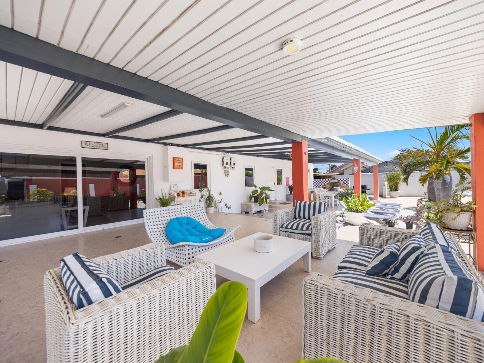 Enjoy the cozy outdoor retreat on our patio of the home in Oranjestad, Aruba - The sitting area provides plenty of room for gatherings and spending quality time with your loved ones