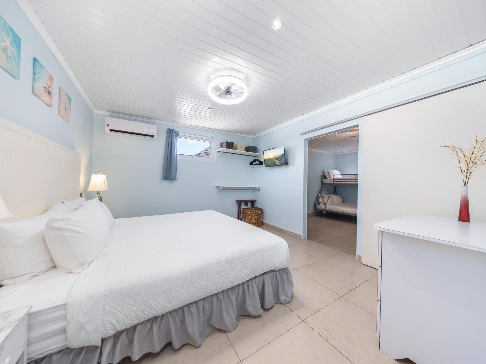 Indulge in opulent relaxation in our stunning bedroom located in Oranjestad, Aruba - Relish the generous, welcoming space featuring a comfortable double bed for a peaceful night - The sophisticated décor seamlessly blends timeless and modern styles