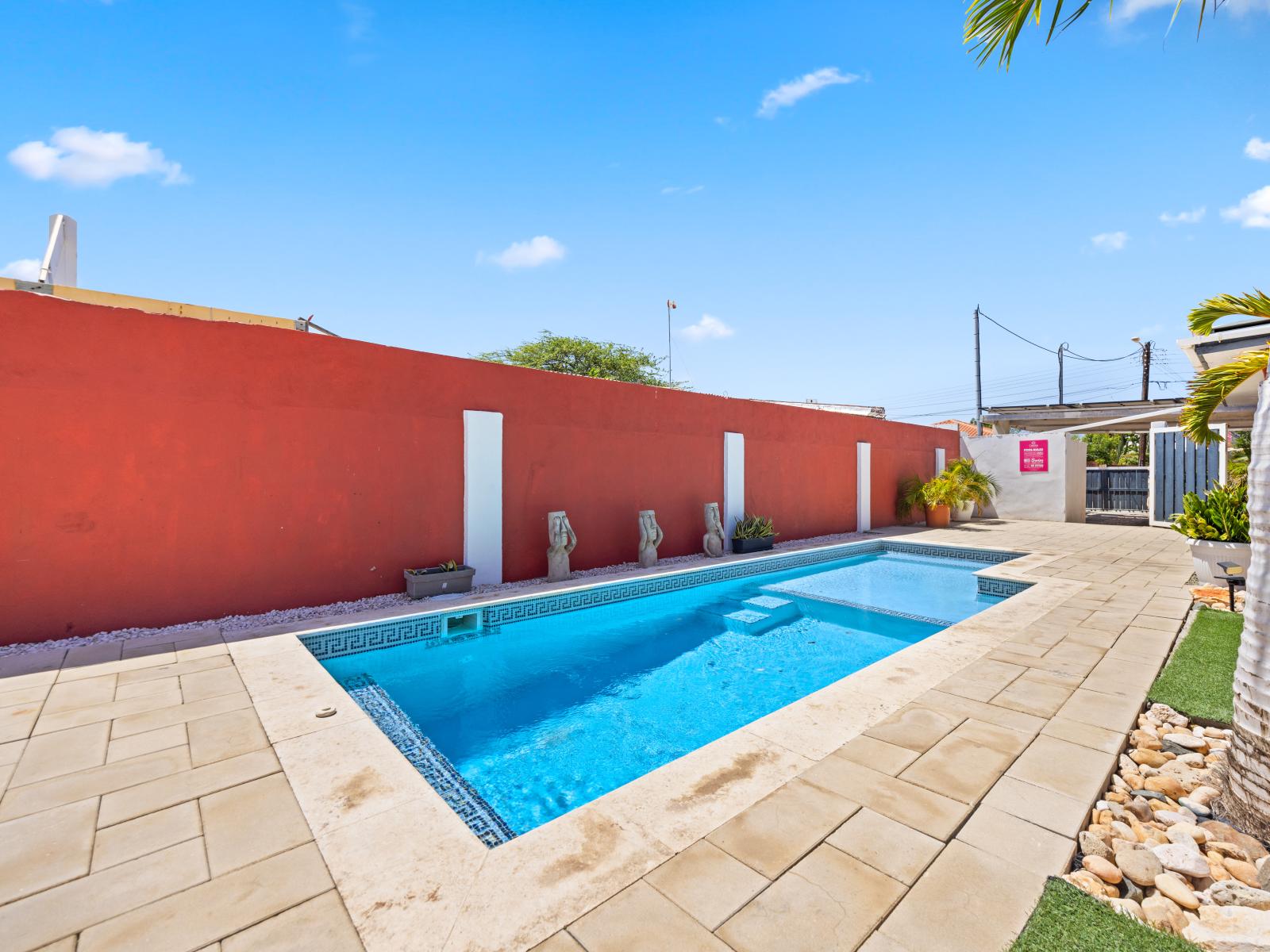 Escape to this resort-like oasis with an amazing pool area of the home in Oranjestad Aruba - Enjoy the sparkling waters of a pristine pool, inviting you to cool off - Take in panoramic views of the surrounding landscape or skyline from the poolside