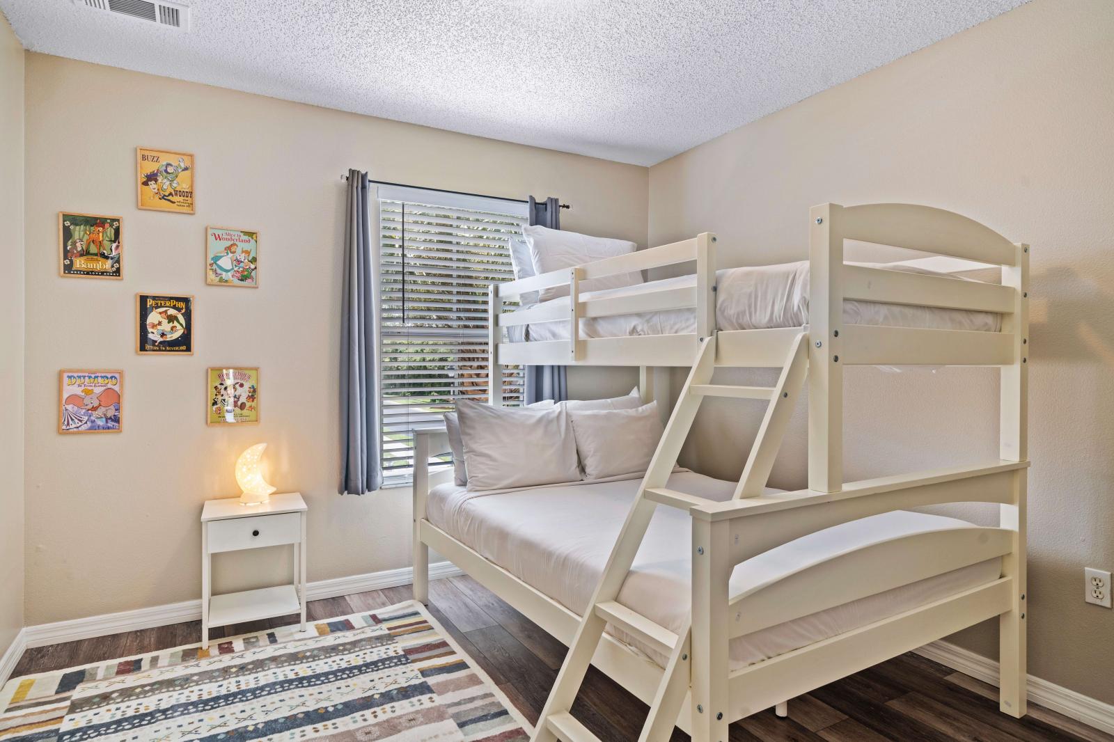 Bunk bed room offers a fun and functional space for kids, with comfortable bedding and cheerful decor - It a cozy spot for bedtime stories or quiet time - Thoughtfully decorated with colorful artwork, this room provides a welcoming environment