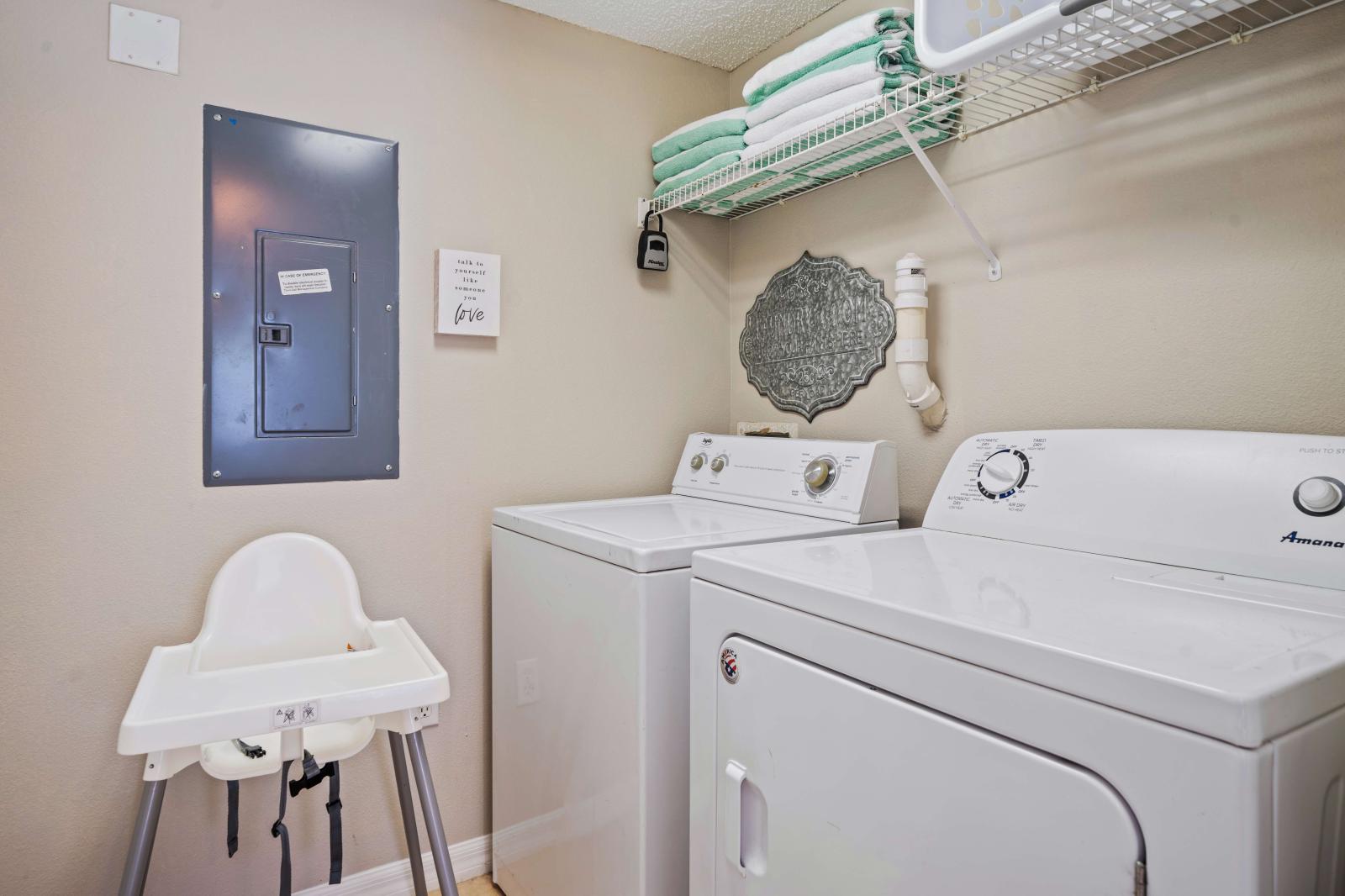 Enjoy the convenience of in-unit laundry with this well-equipped laundry area - Includes a high chair for young children, making it a family-friendly space for all your needs - Provides a practical and efficient space for keeping up with chores