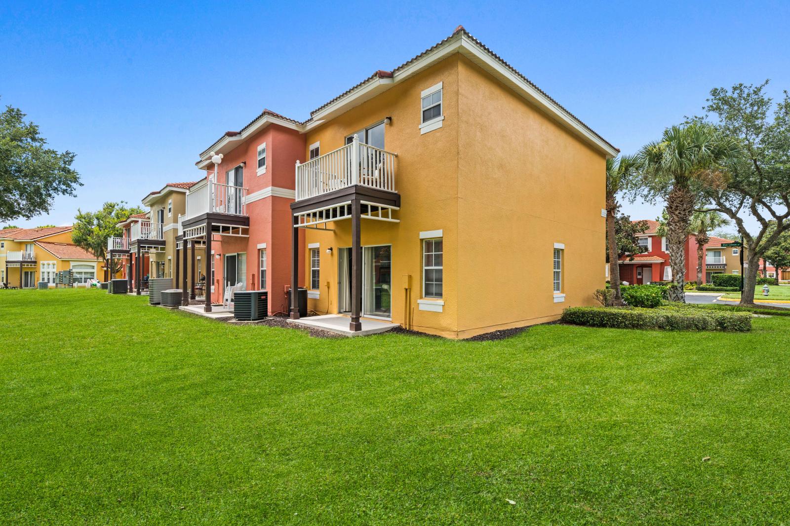 Inviting architecture combine to the comfort and convenience, creating a captivating townhouse in Kissimmee Florida - The outside view-with  lush greenery, serene landscapes - A unique building with innovative and elegant architecture