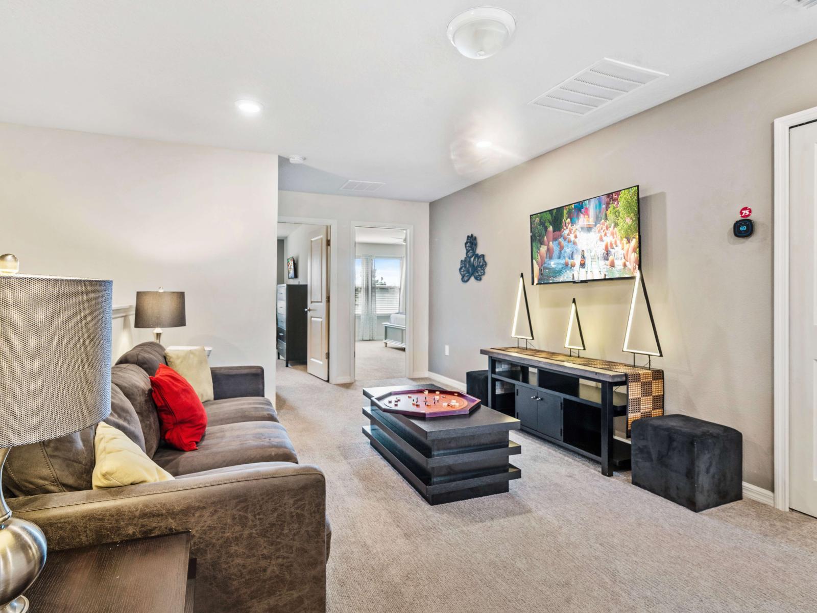 The loft area is designed for comfort and entertainment, making it a perfect spot to unwind - A multi-tiered game table offers a fun and interactive element - Perfect for enjoying movies, and video games, providing a focal point in the loft