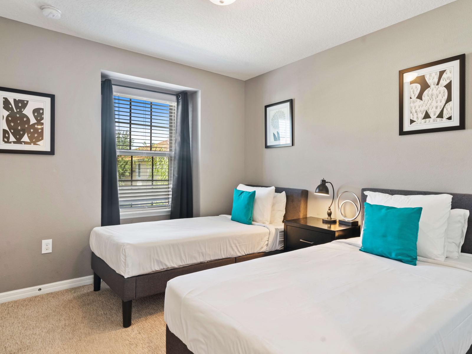 Bedroom features two cozy single beds, ideal for kids or friends to share - Enjoy a restful night's sleep on plush bedding and stylish accent pillows - Stay entertained with the smart TV, perfect for movie nights or catching up on shows