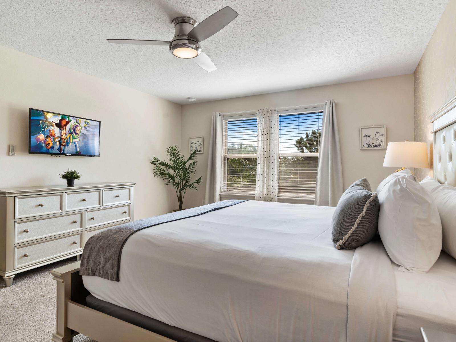 Indulge in a king-size bed, bask in the natural light streaming through the large windows, creating a serene atmosphere - Unwind with your favorite shows on the wall-mounted smart TV - Private ensuite bathroom for added convenience and privacy