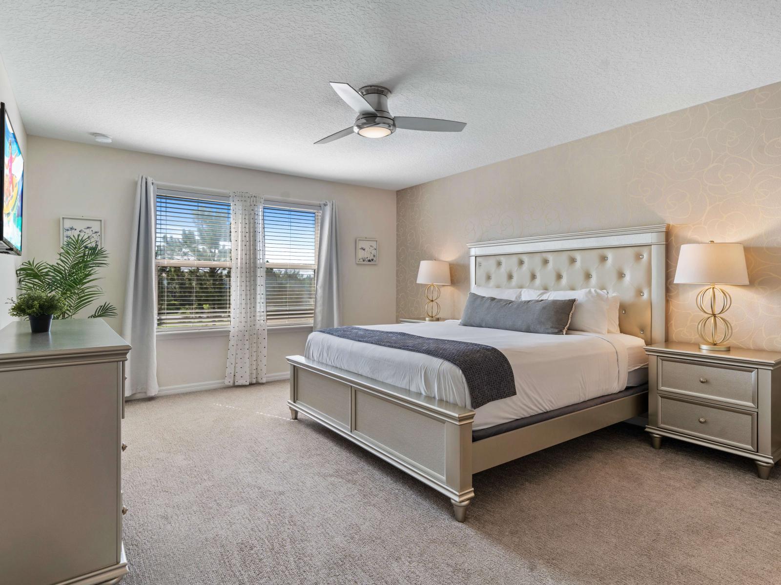 Relax in a spacious retreat with a plush king-size bed and a private bathroom - Catch up on your favorite shows with the wall-mounted smart TV - Bask in the natural light and elegant decor that create a warm, inviting atmosphere