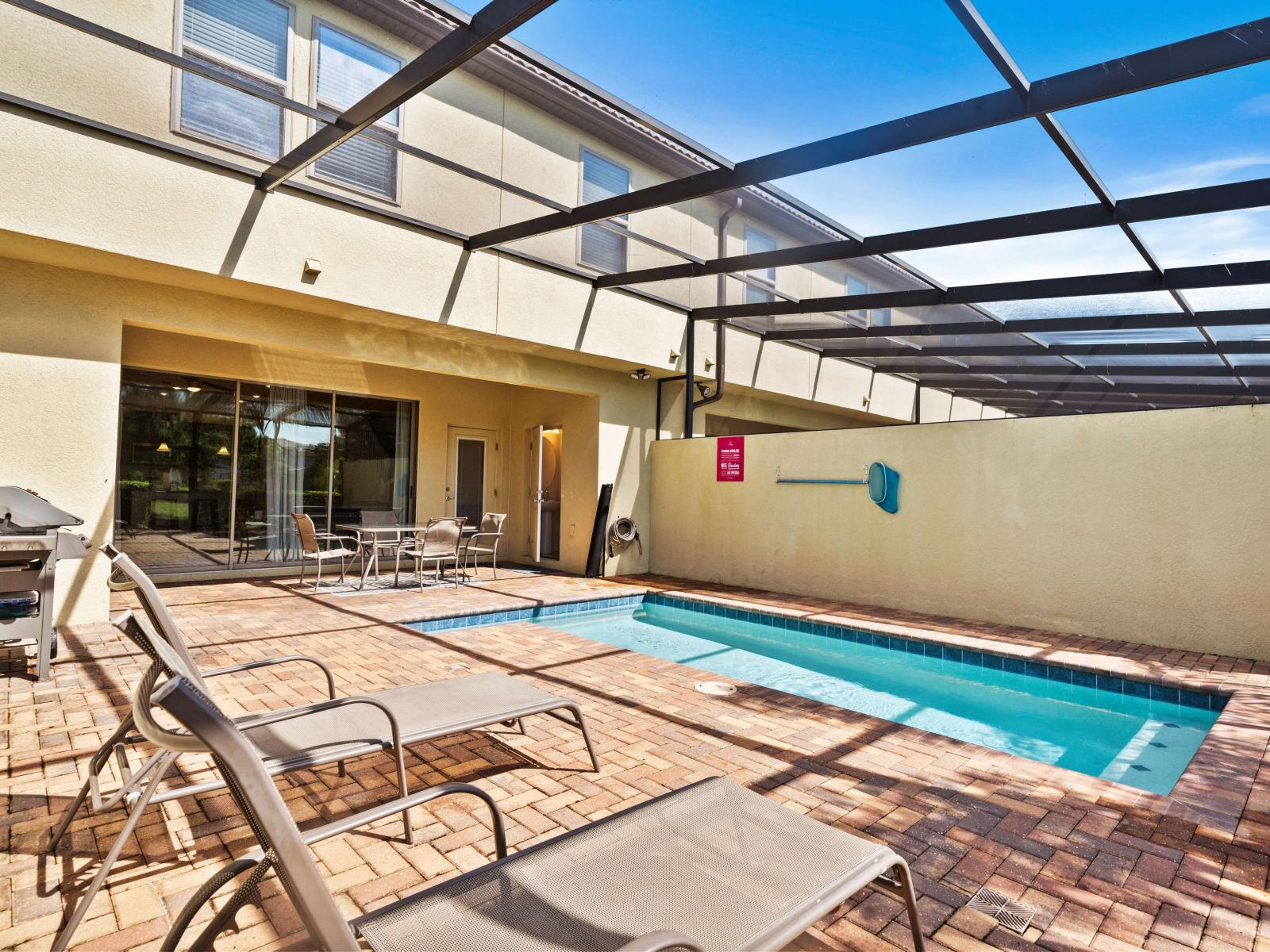 Enjoy your private, screened pool perfect for a refreshing dip - Lounge comfortably on sun chairs and let the warmth embrace you - Fire up the BBQ grill and savor delicious meals on the patio dining set