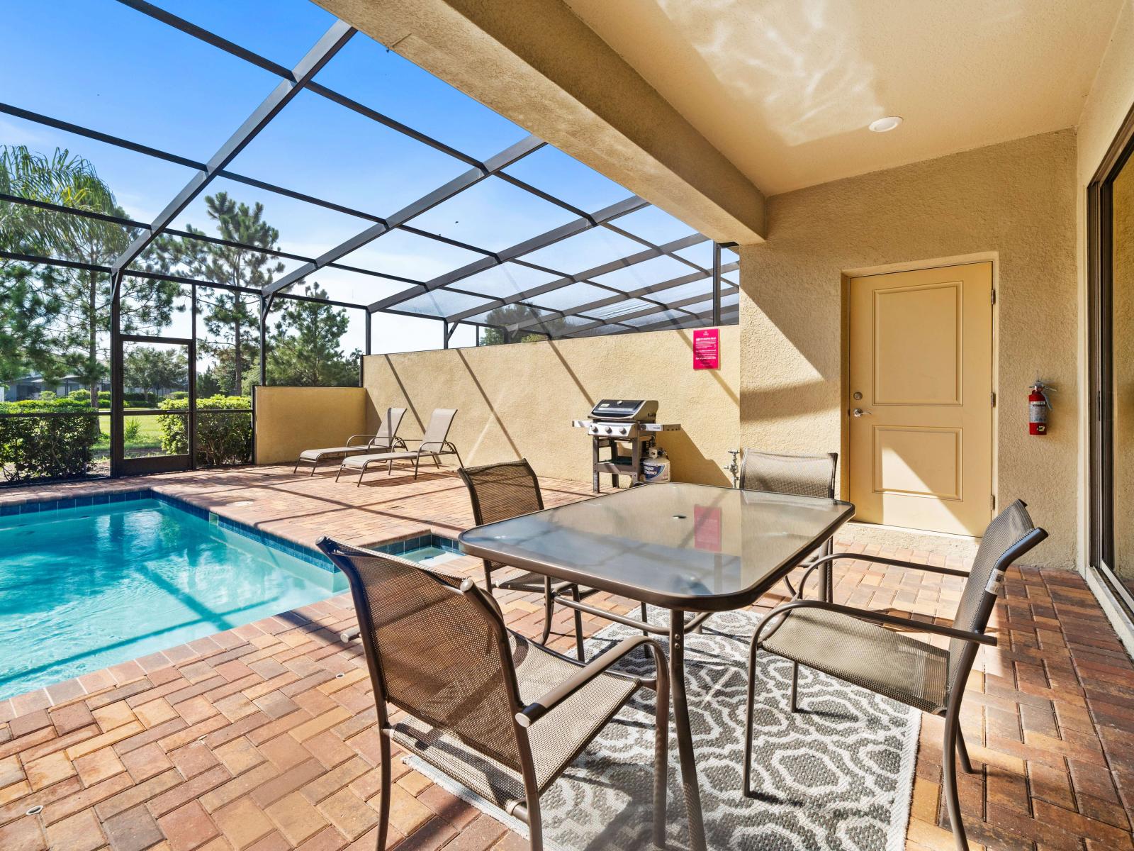 Dive into your private screened-in pool and let the cool waters wash your worries away - Stretch out on sunbeds and bask in the golden sunshine - Ignite the grill and savor a mouthwatering meal in your cozy outdoor dining haven