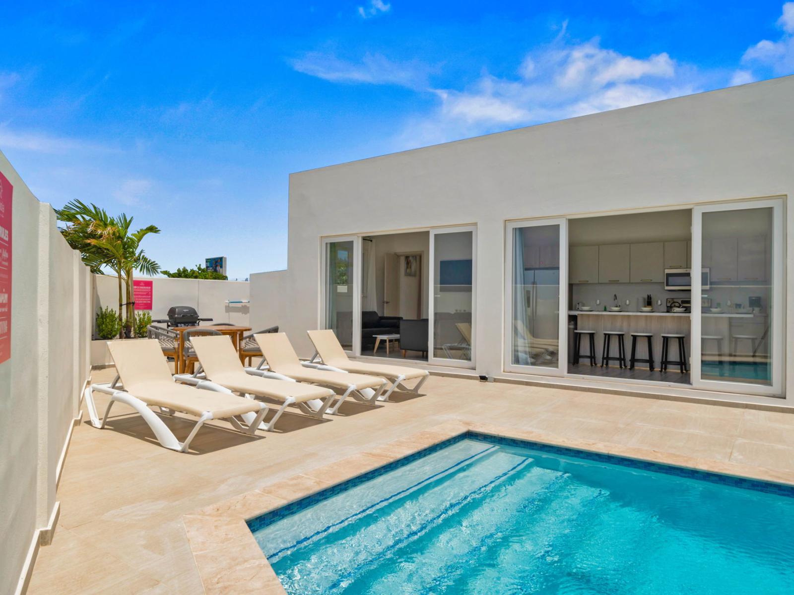 Savor the sunshine at the inviting private pool area